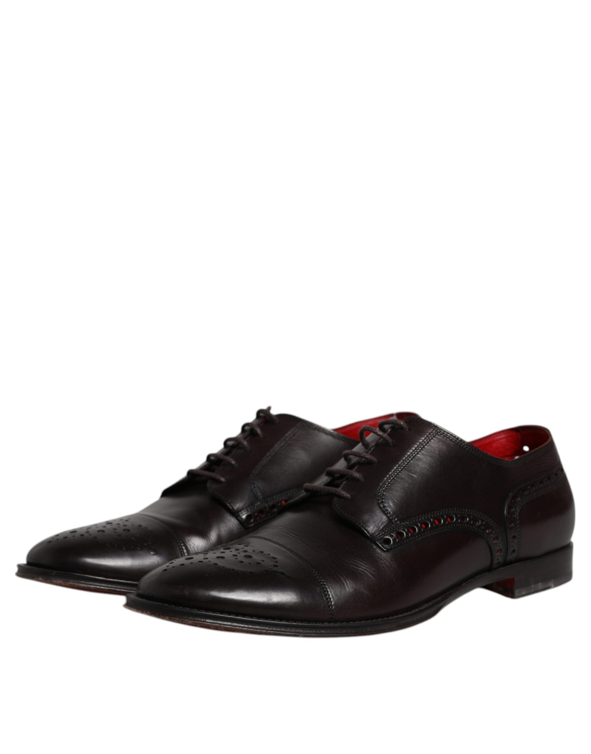 Pair of black leather dress shoes with laces and red accents, featuring a derby style