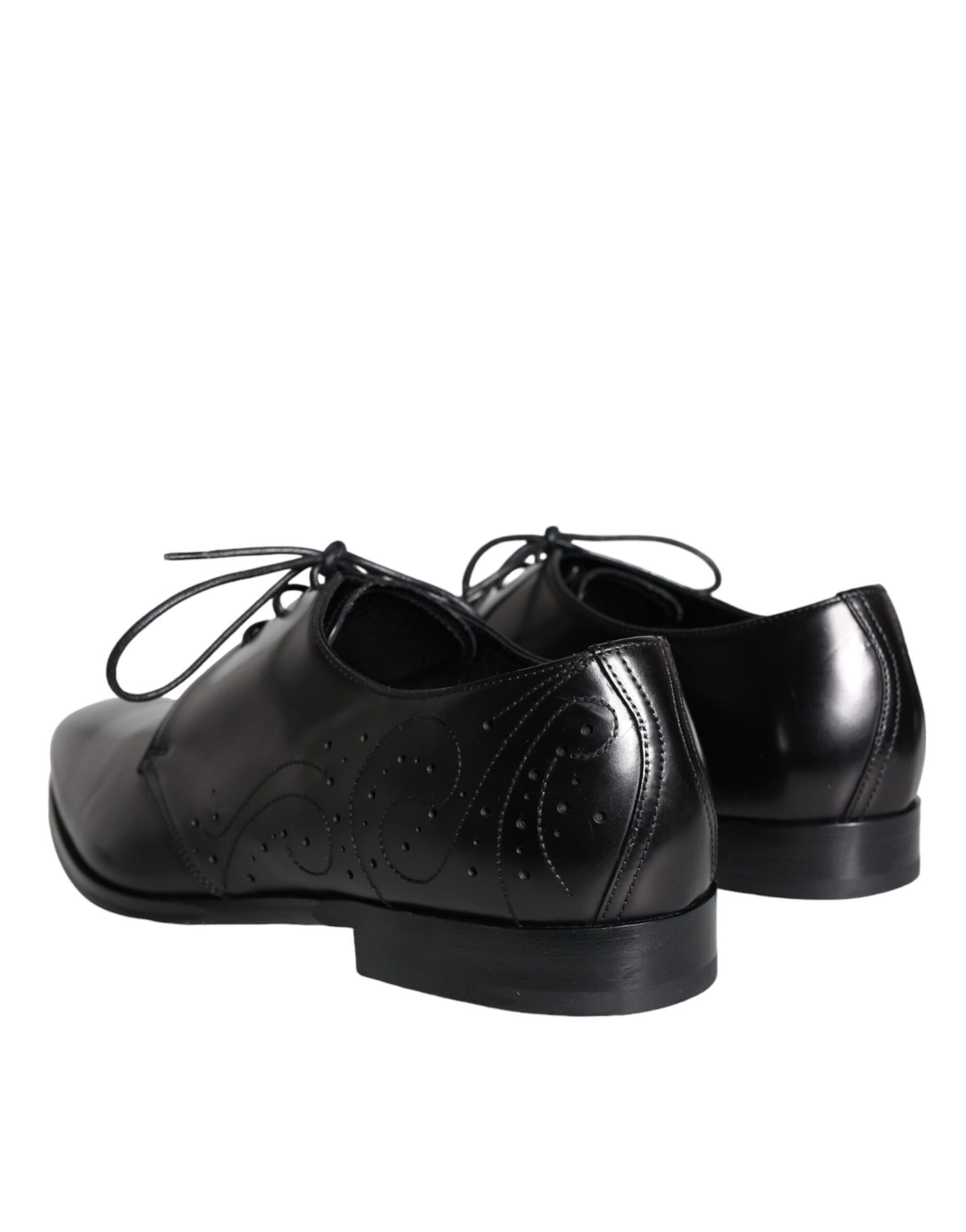Pair of black leather dress shoes with laces and a small heel, featuring a textured design on the vamp