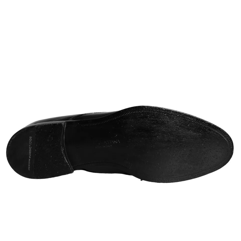 A pair of black leather dress shoes with a shiny finish, featuring a lace-up design and a small heel