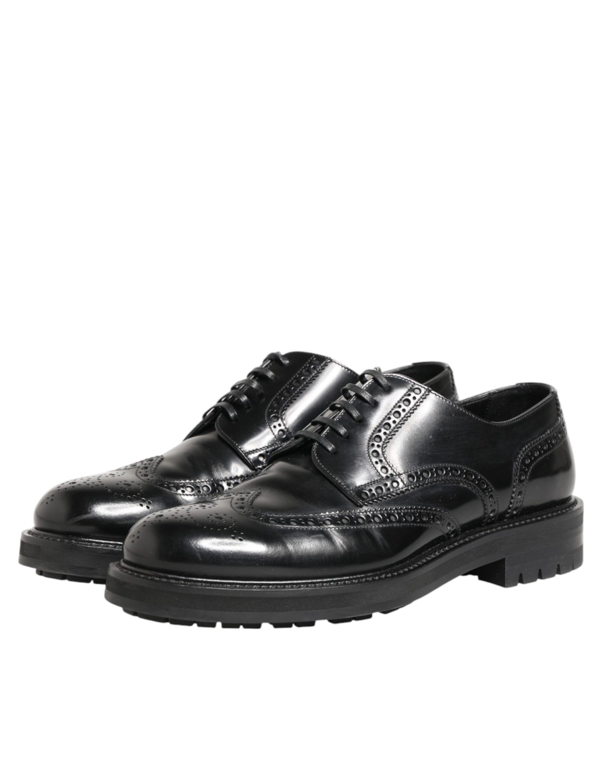 Pair of black leather dress shoes with laces and a small heel, featuring a shiny finish