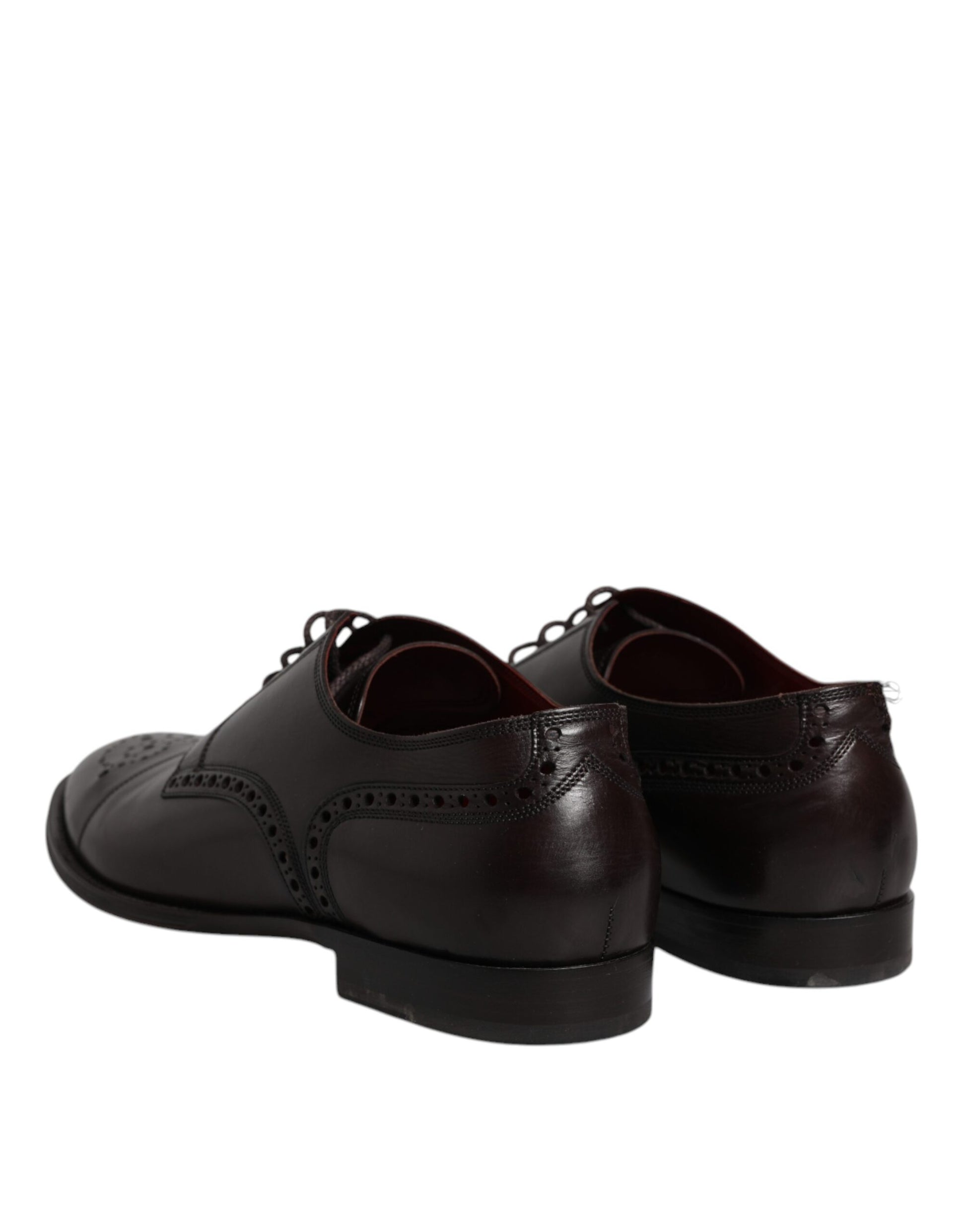 Pair of black leather dress shoes with laces and a small heel