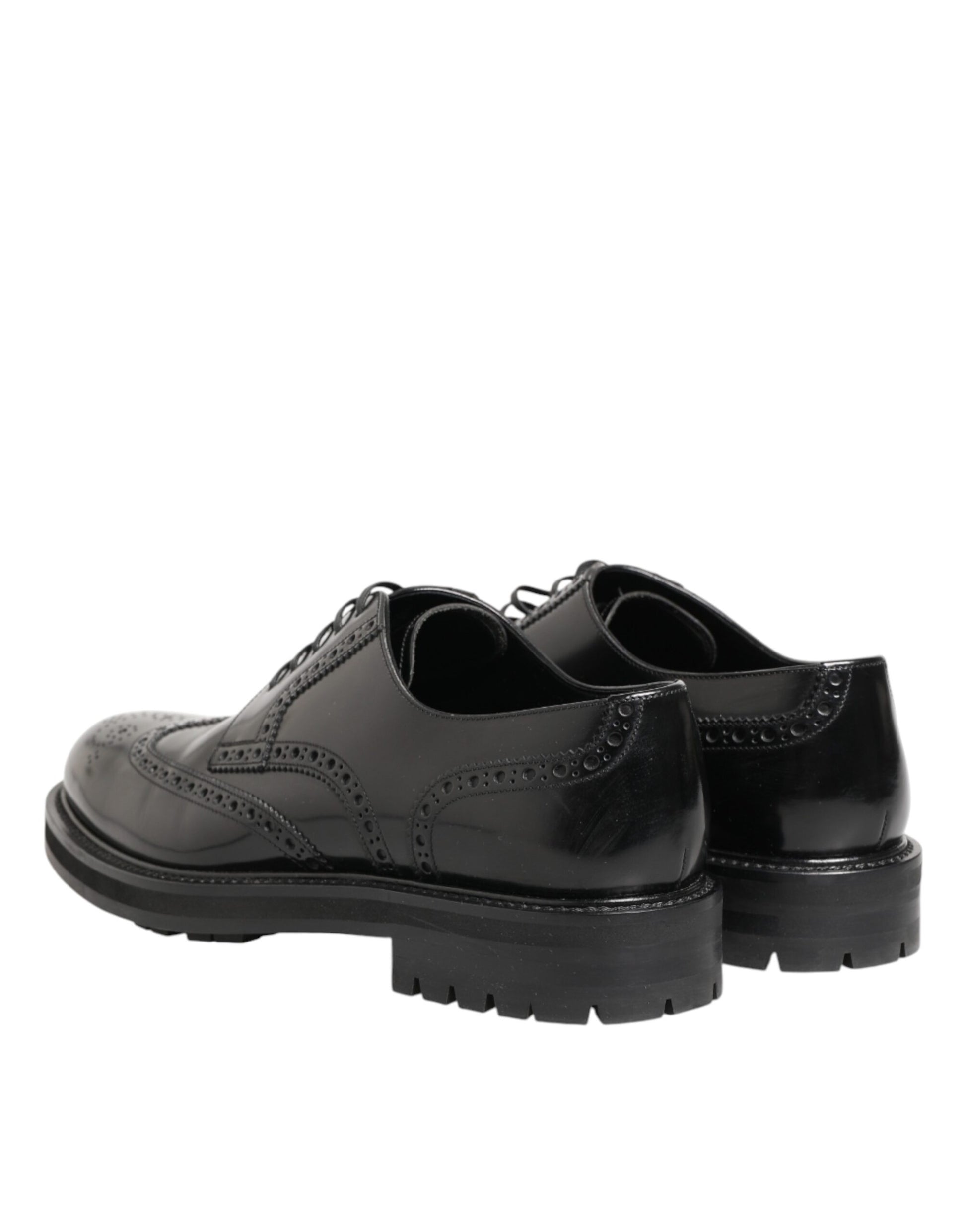 Pair of black leather dress shoes with laces and chunky heels, designed by Dolce & Gabbana