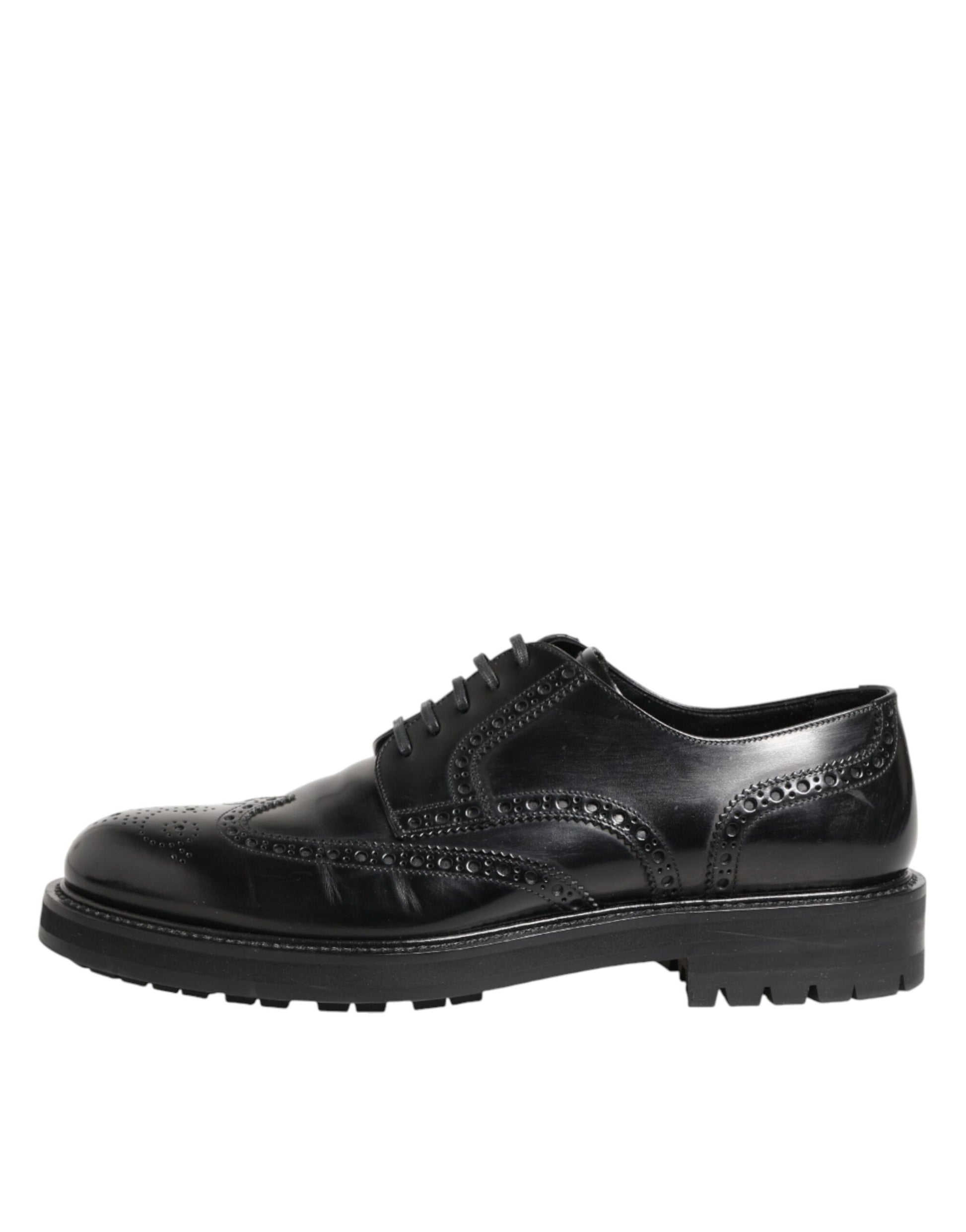 A pair of black leather dress shoes with a lace-up design and embossed details