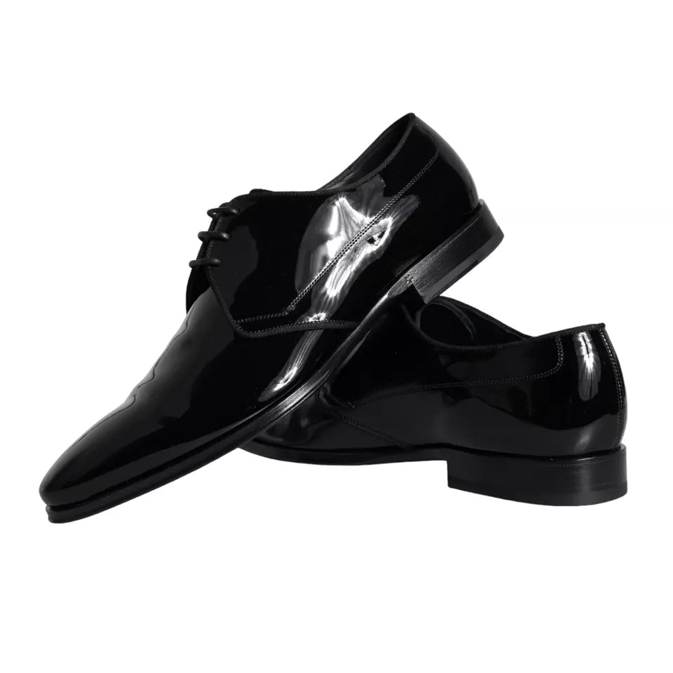 Pair of black leather dress shoes with silver buckle detailing