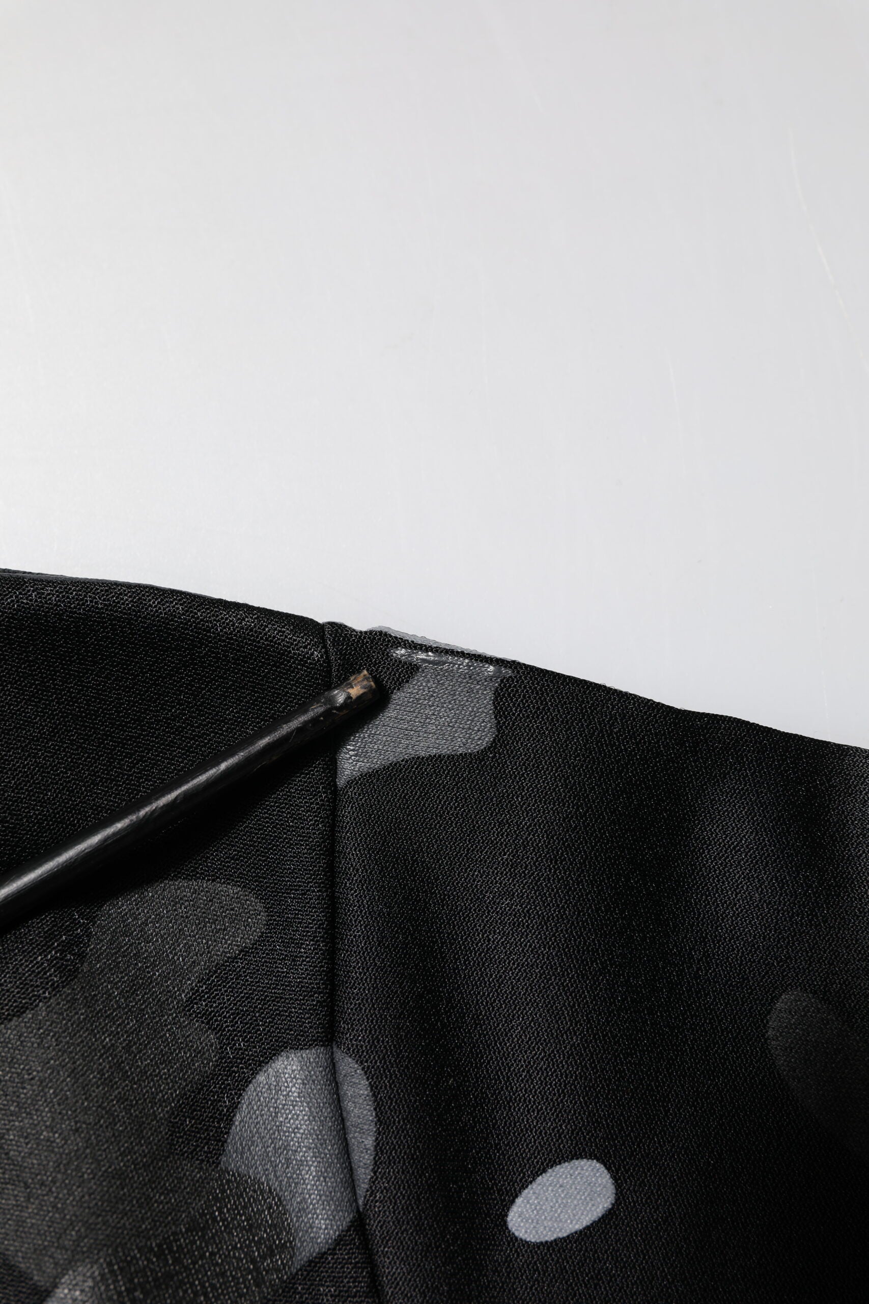 Black fabric with white dots