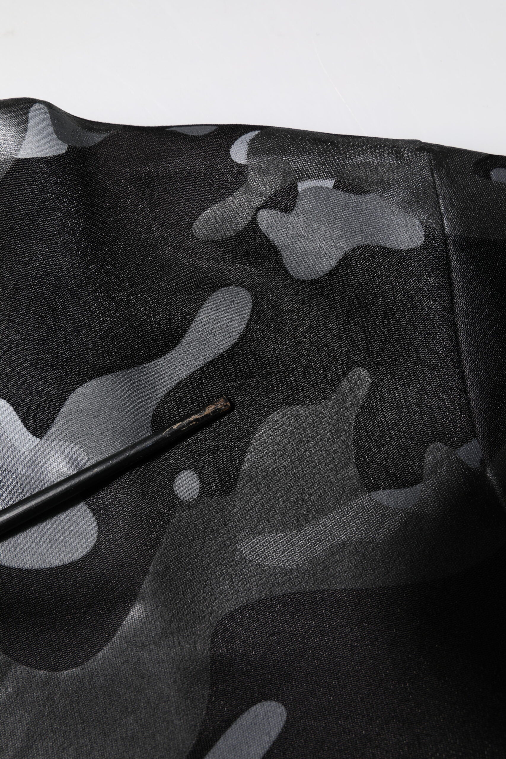 Camouflage fabric with a black background