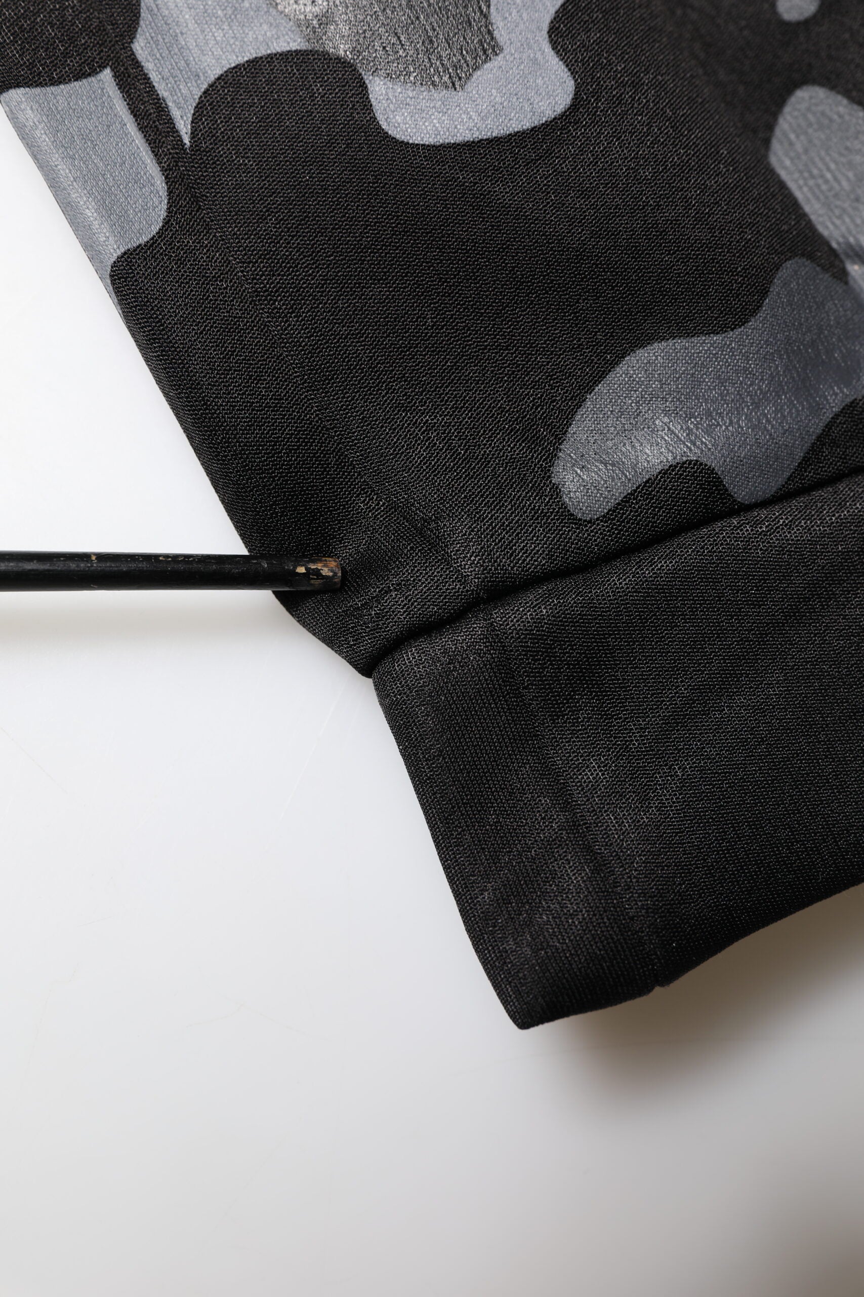 Black camouflage fabric with white pattern