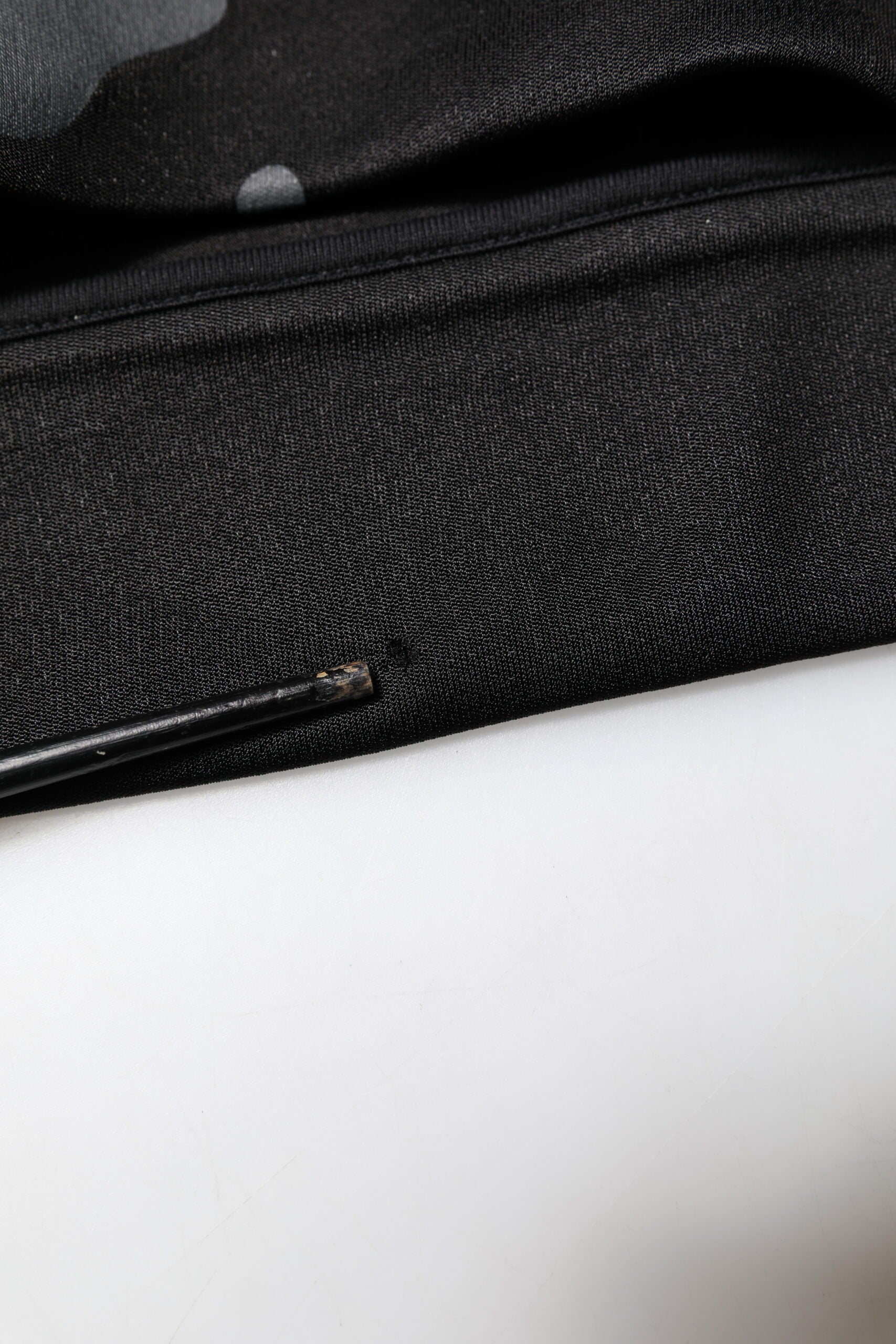 Black fabric with a zipper on top