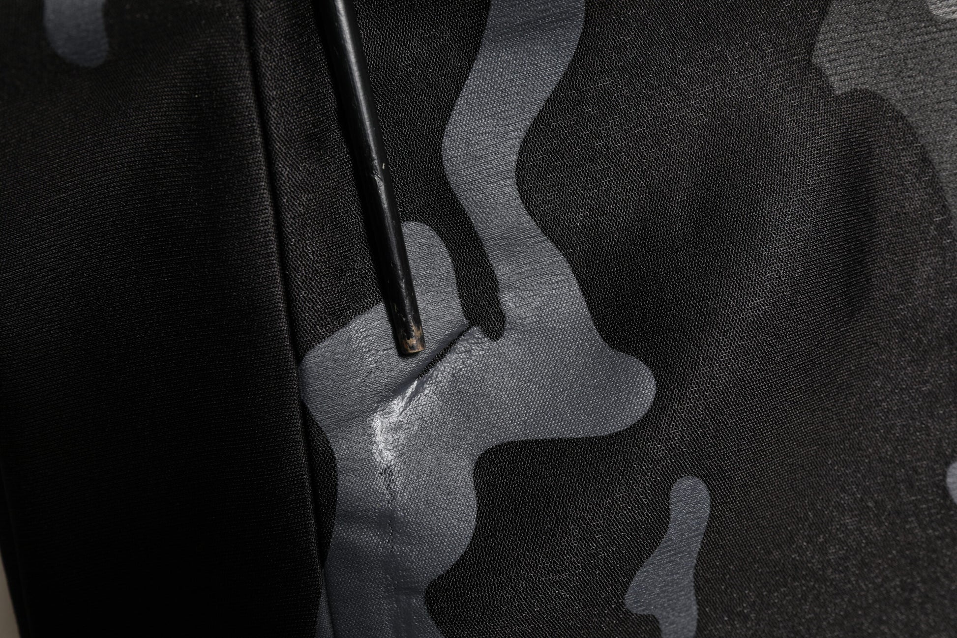 Black fabric with white design on back