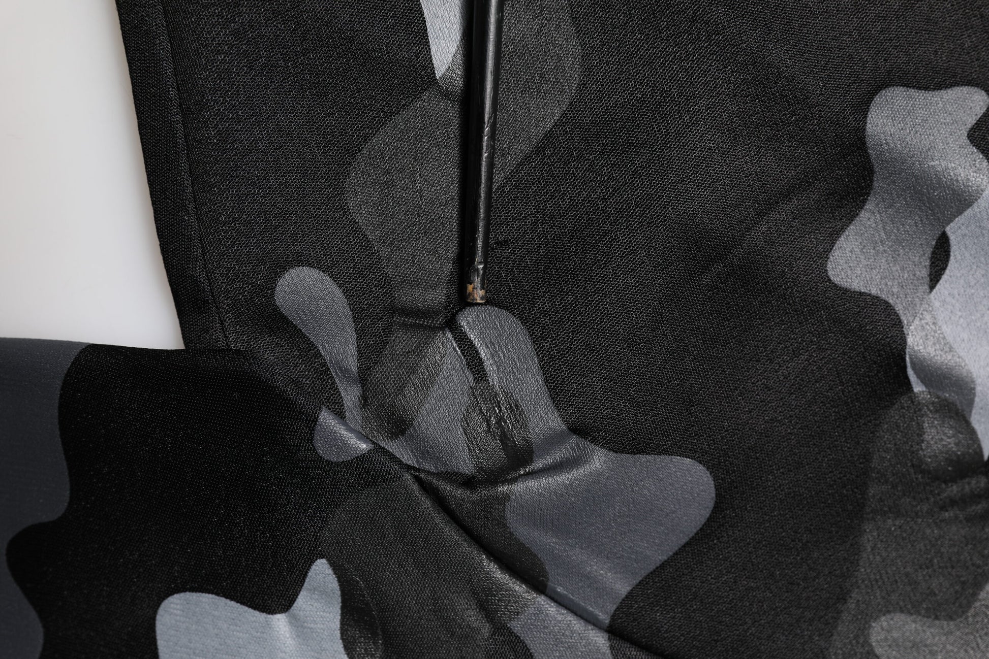 Camouflage patterned fabric with zipper closure