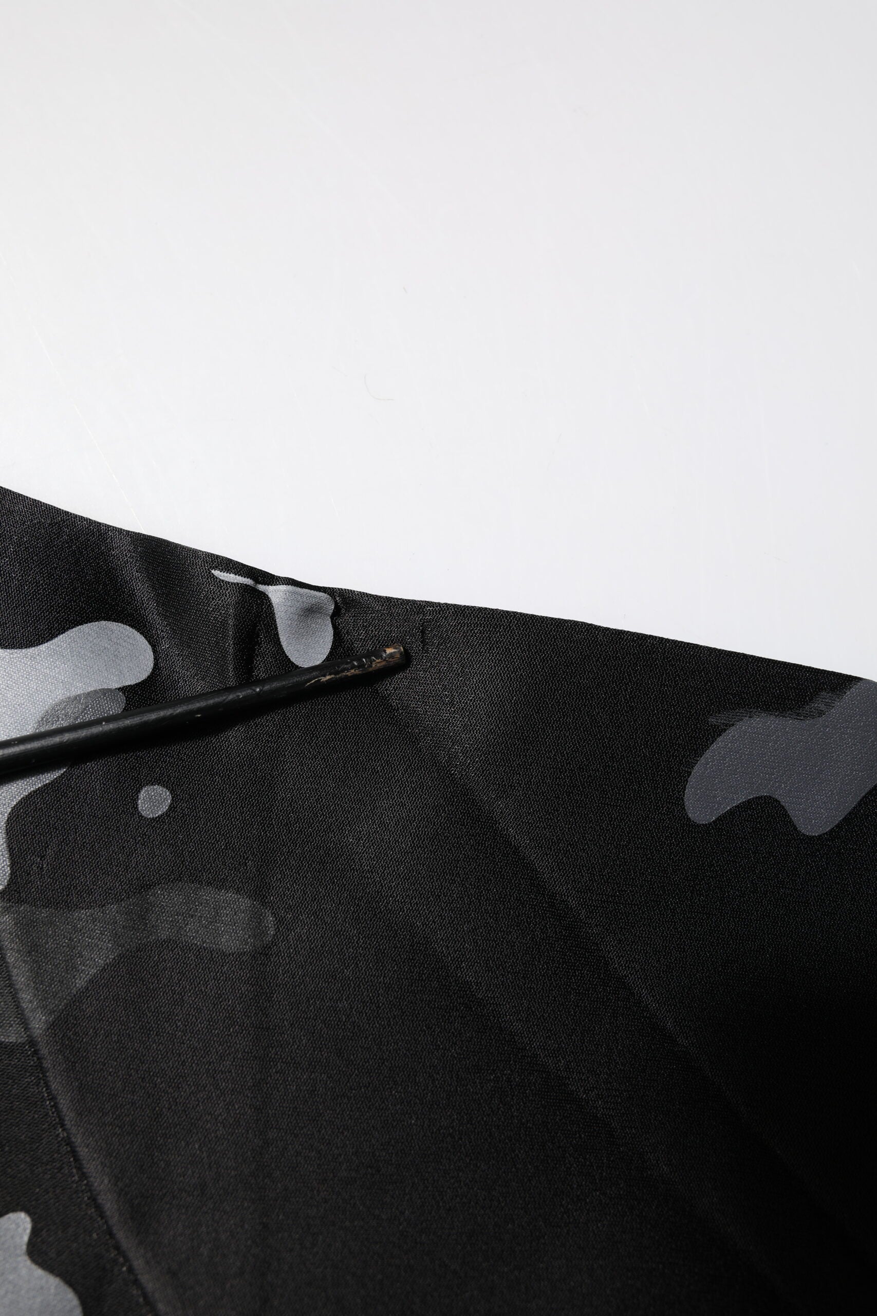 Black fabric with white specks on it