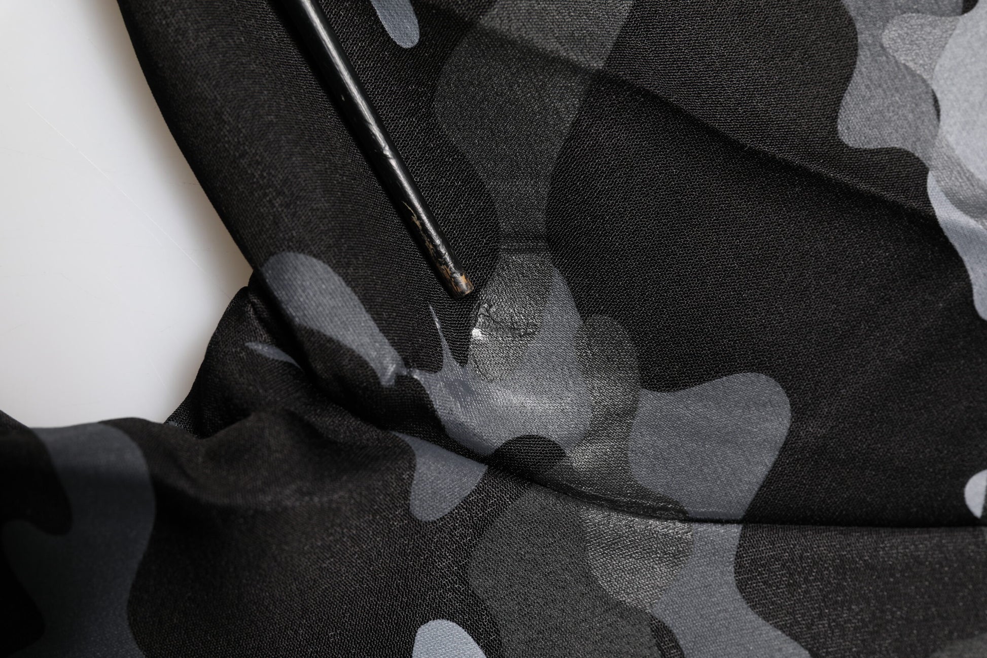 Black camouflage fabric with white floral pattern