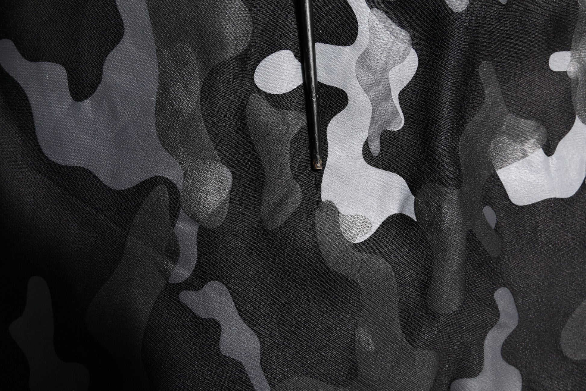 Camouflage fabric with irregular shapes and patterns