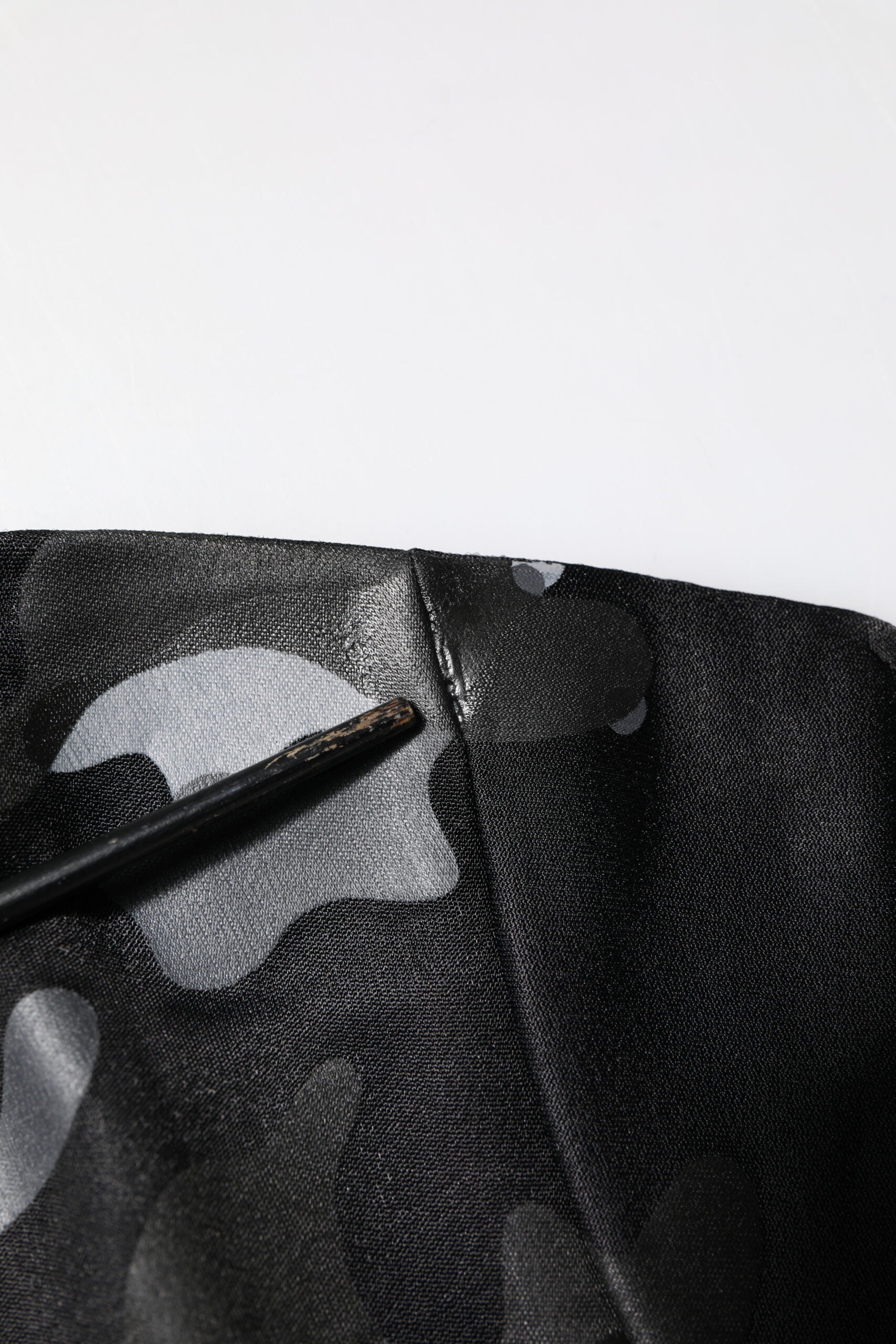 Black fabric with white apple logo