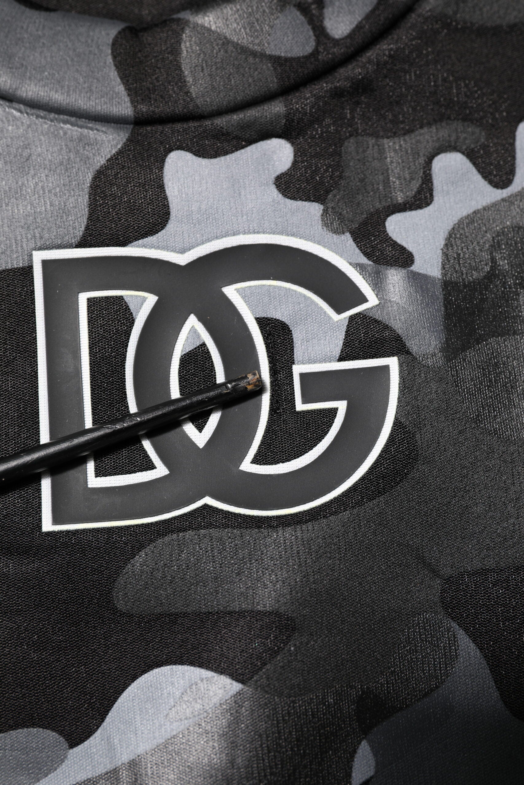 Camouflage shirt with white letters