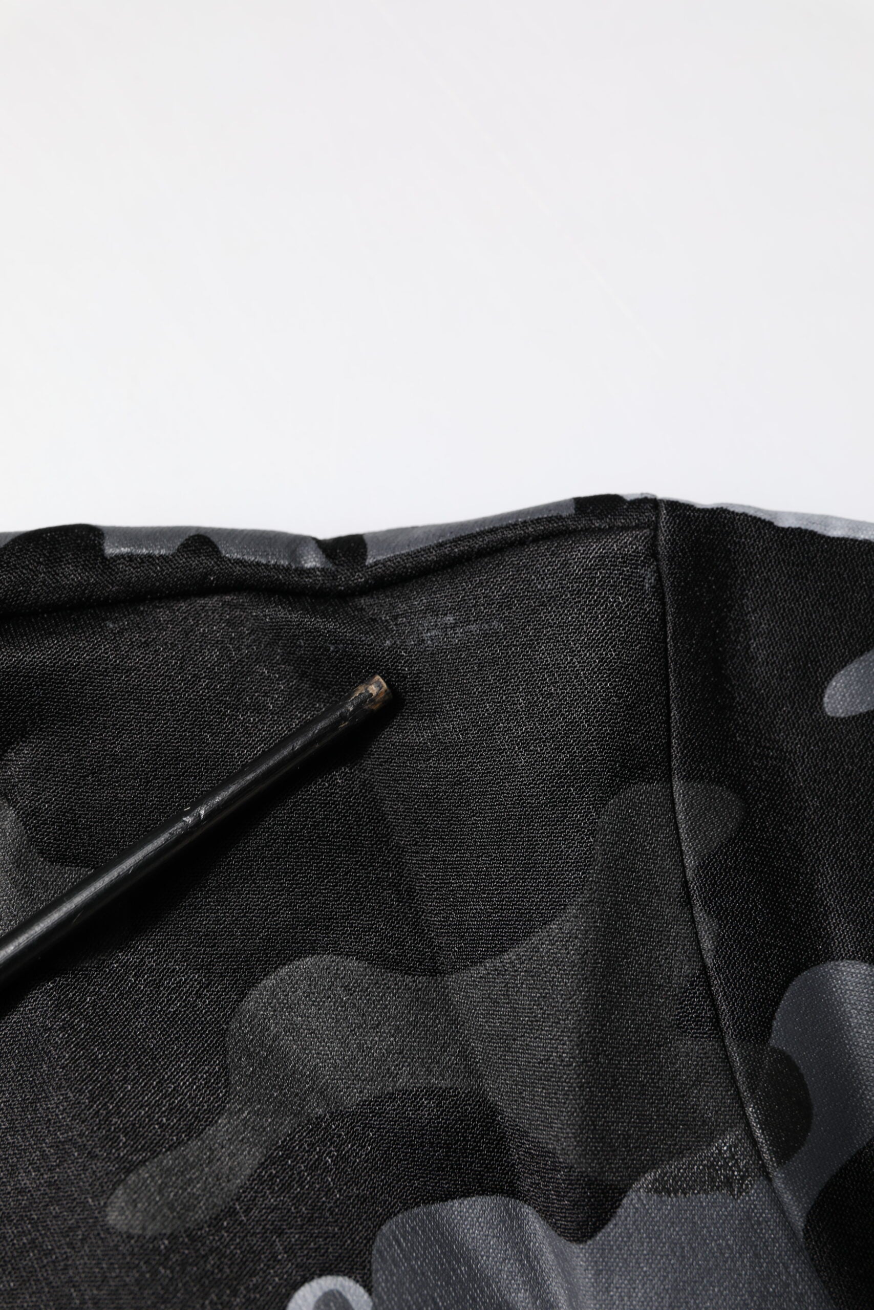 Black fabric with a hole in it