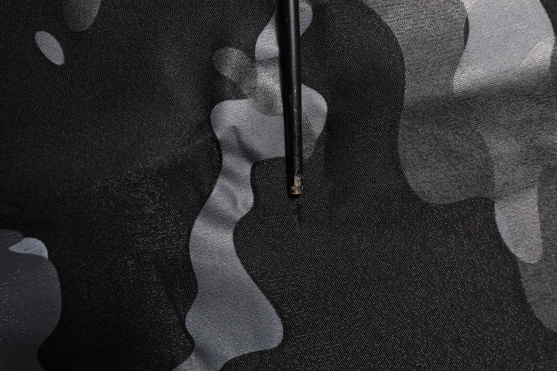 Camouflage fabric with a person wearing it
