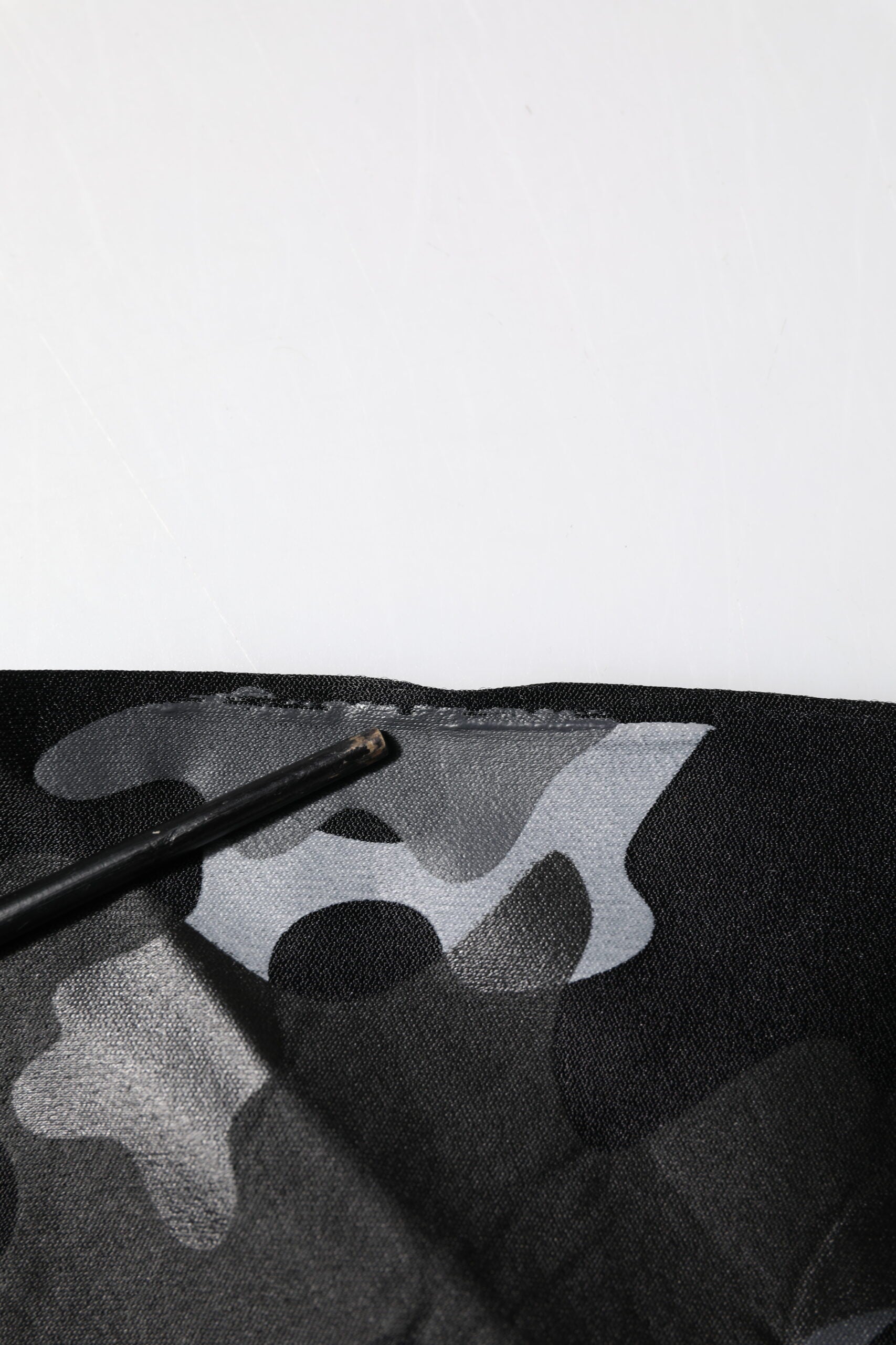 Black pen on fabric