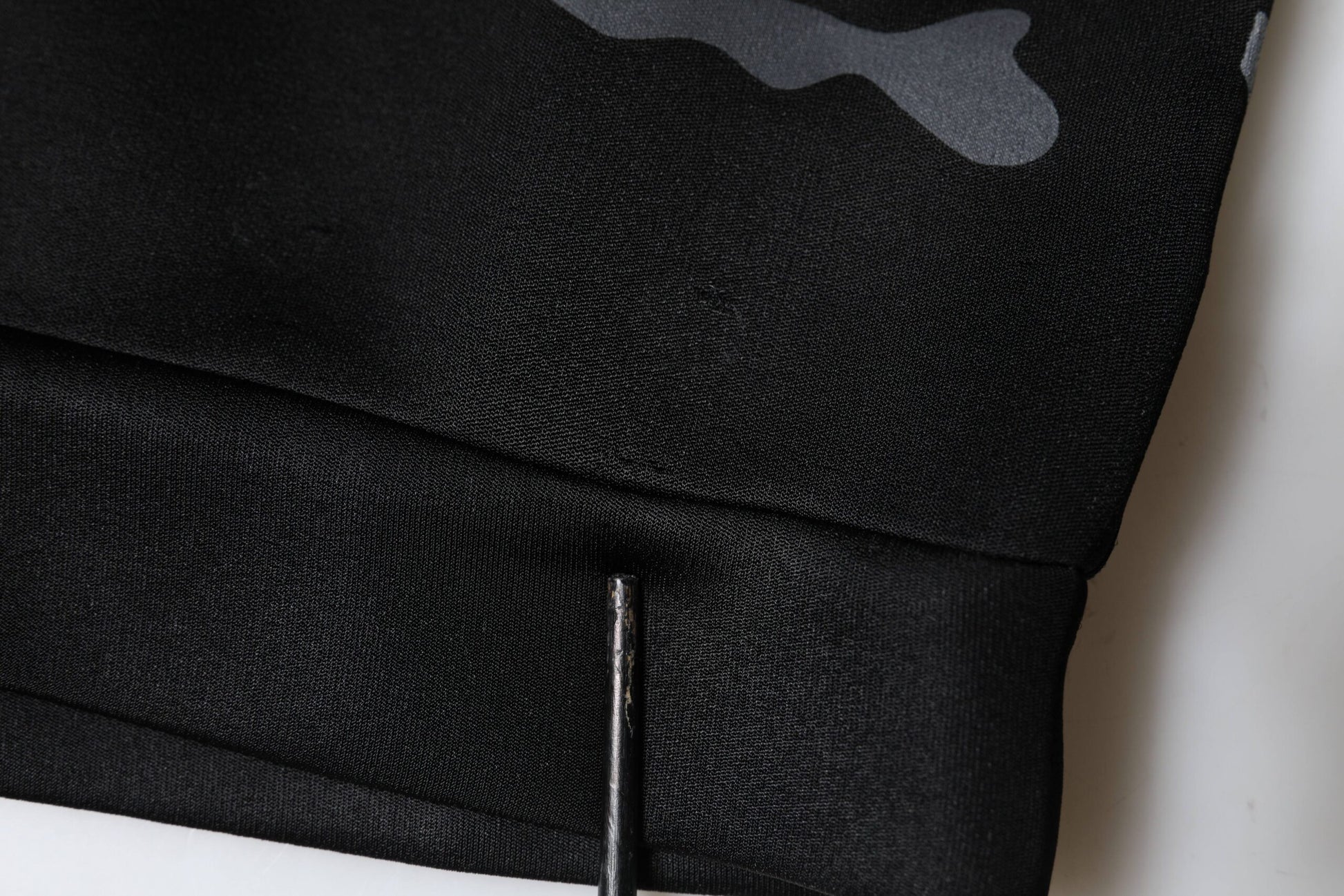 Black fabric with white logo on side