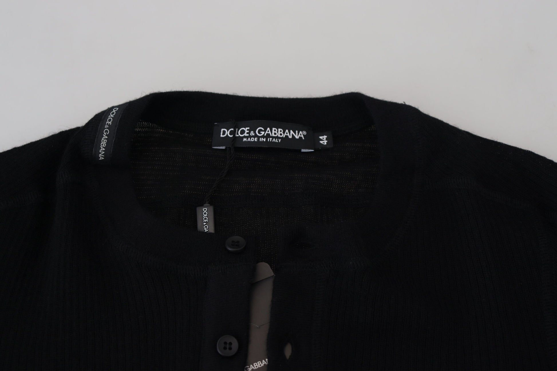 Black sweater with label on front