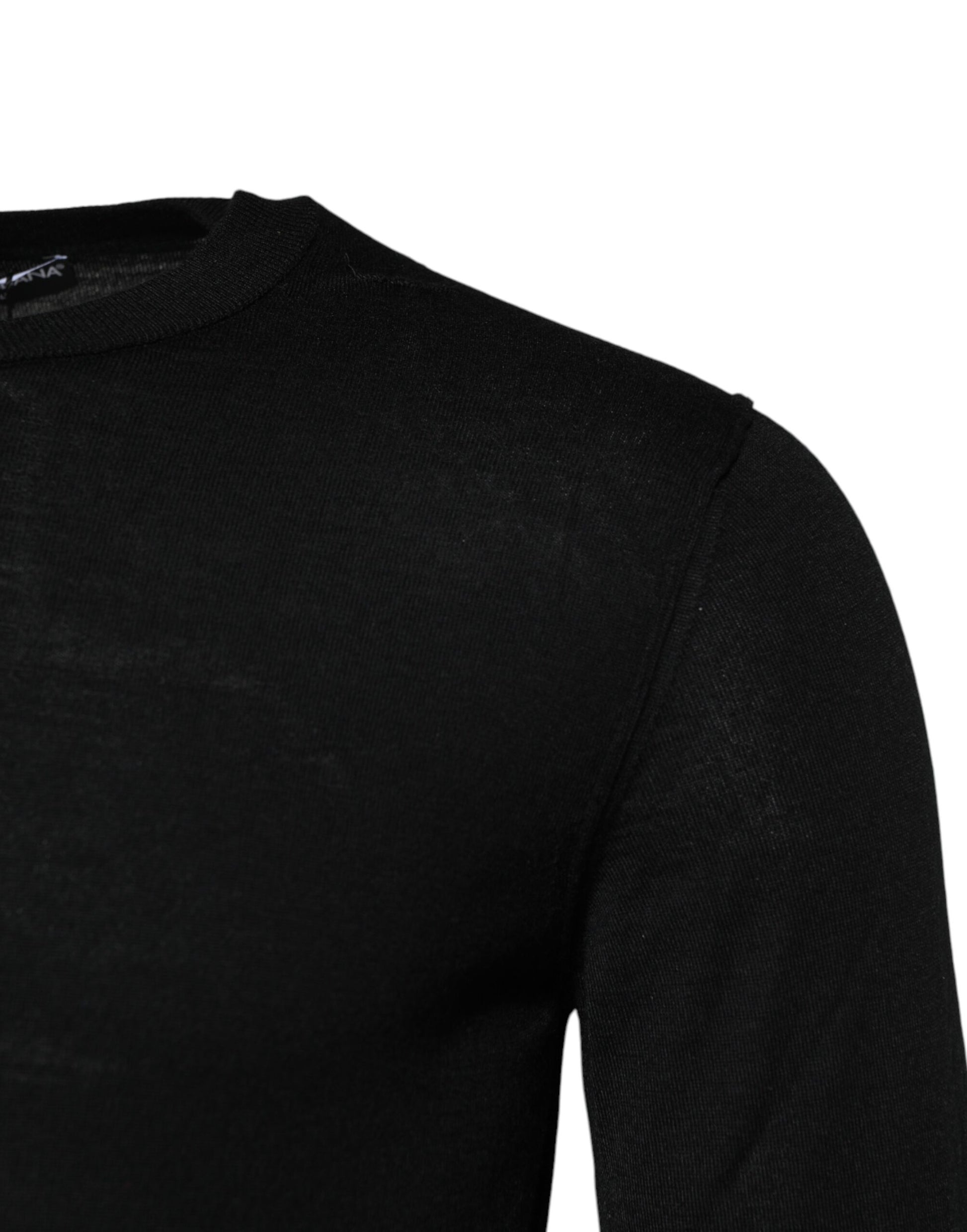 Black long sleeve shirt on a hanger