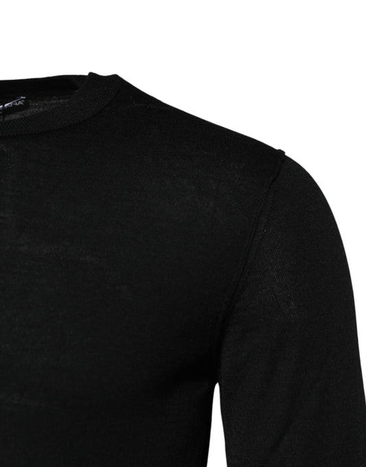 Black long sleeve shirt on a hanger