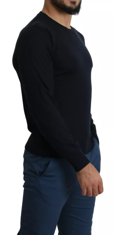 Man wearing dark shirt and blue pants