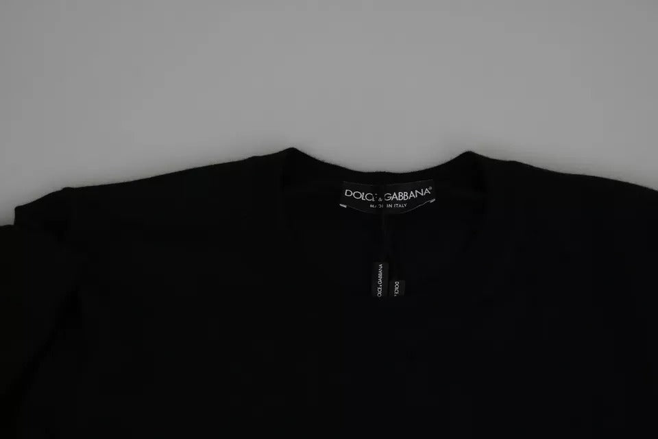 Black long sleeve shirt on hanger