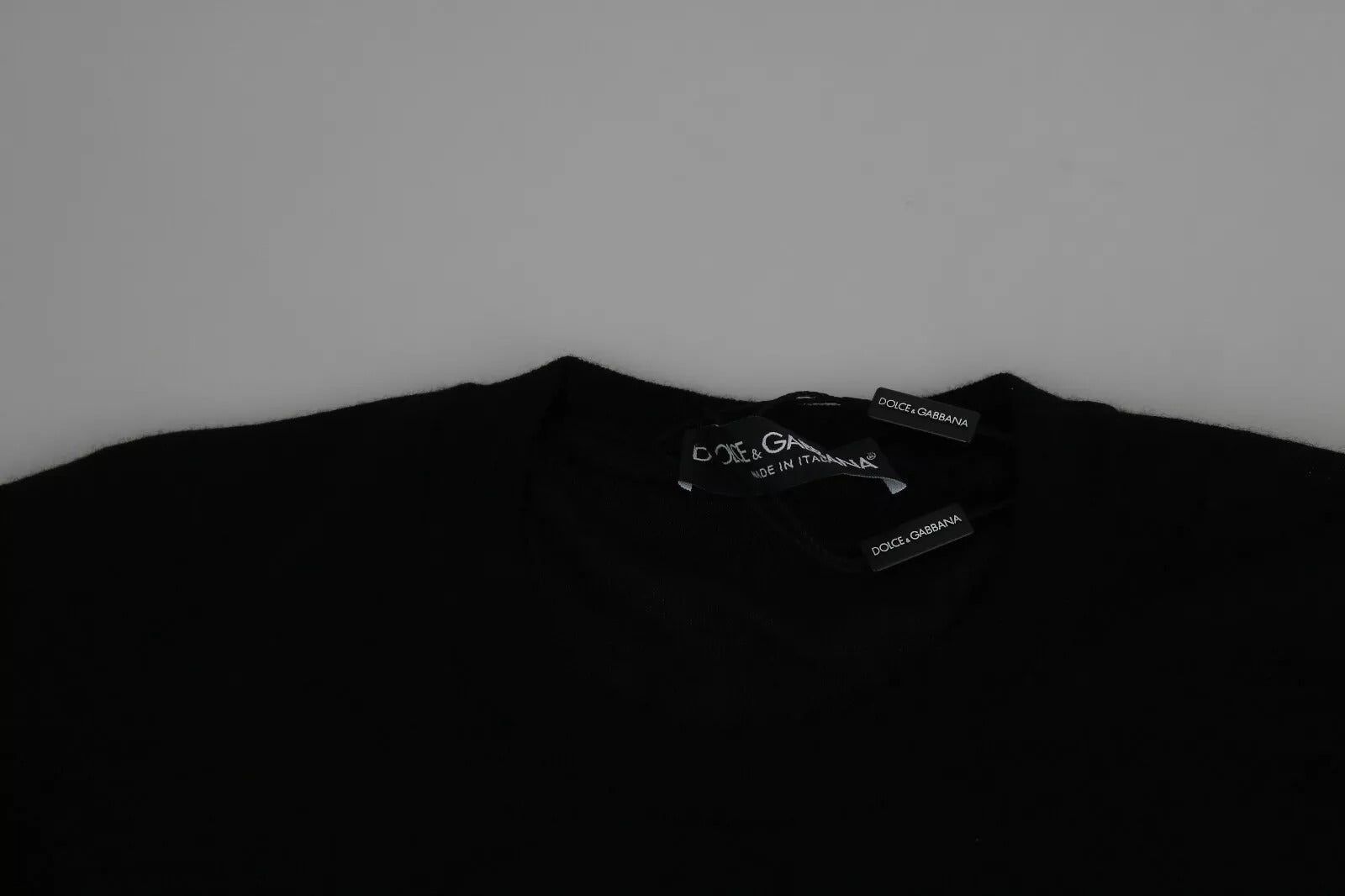 Black fabric with white writing on it