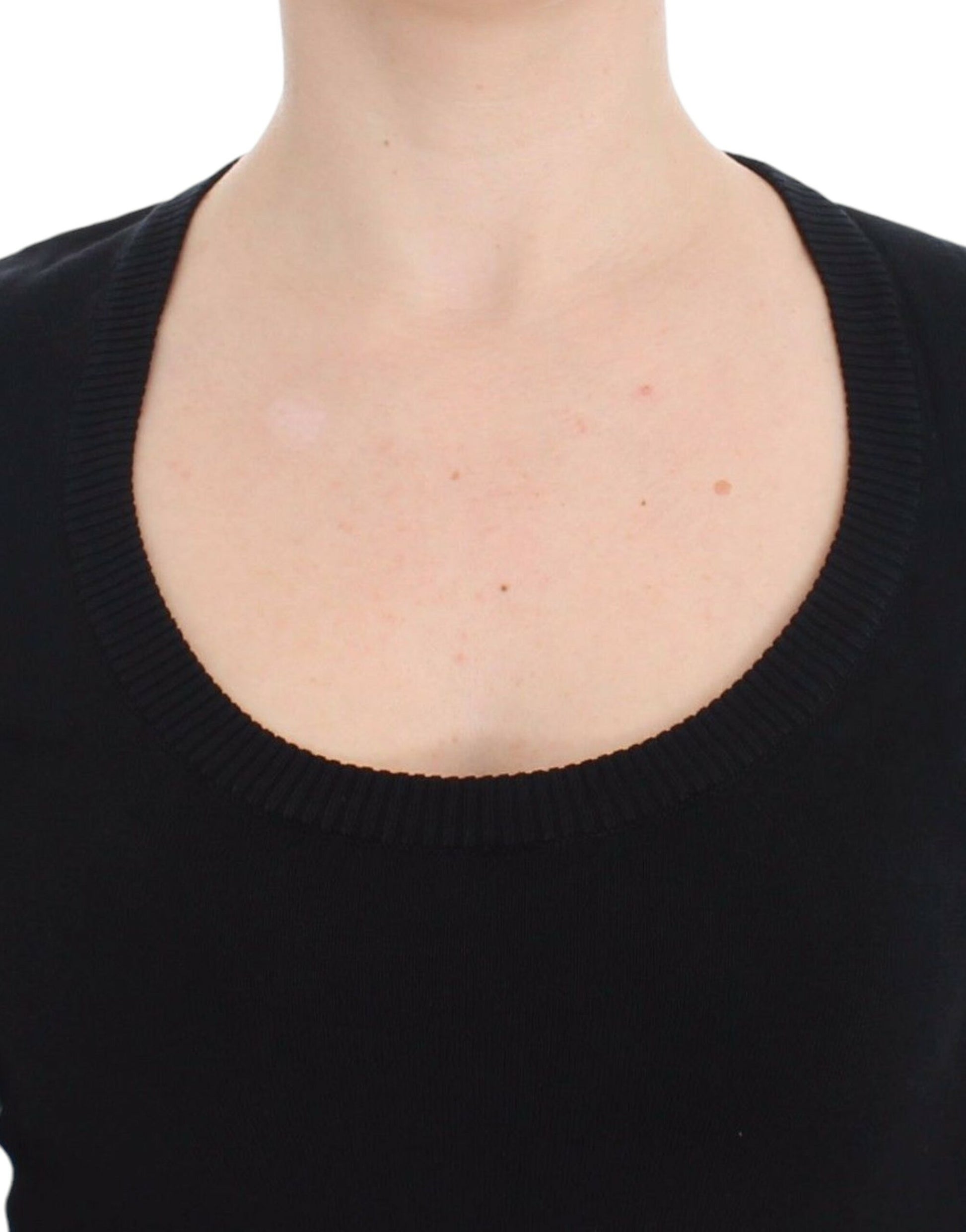 Woman wearing black sweater with round neckline