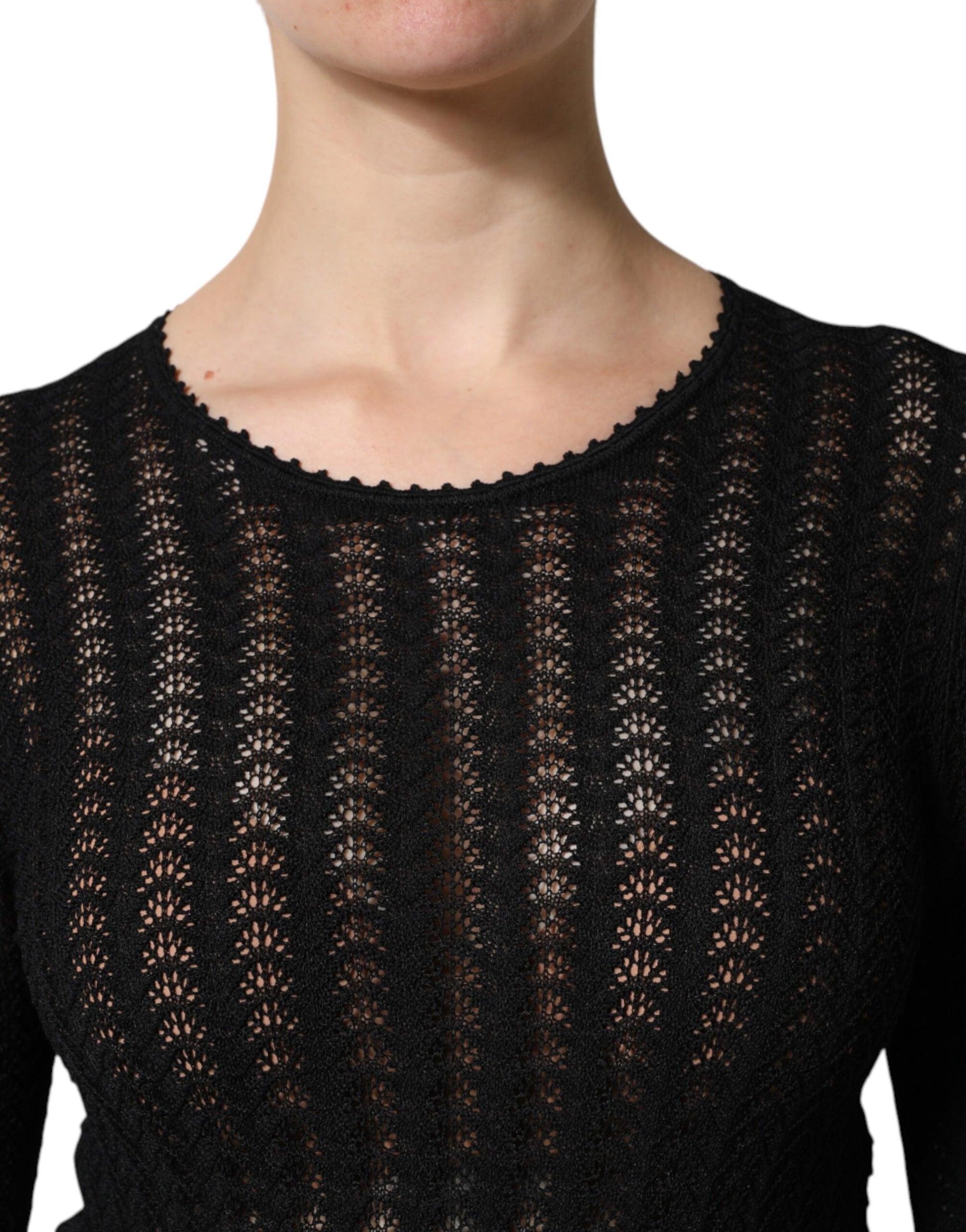 A black cashmere long sleeve midi dress with a lace neckline