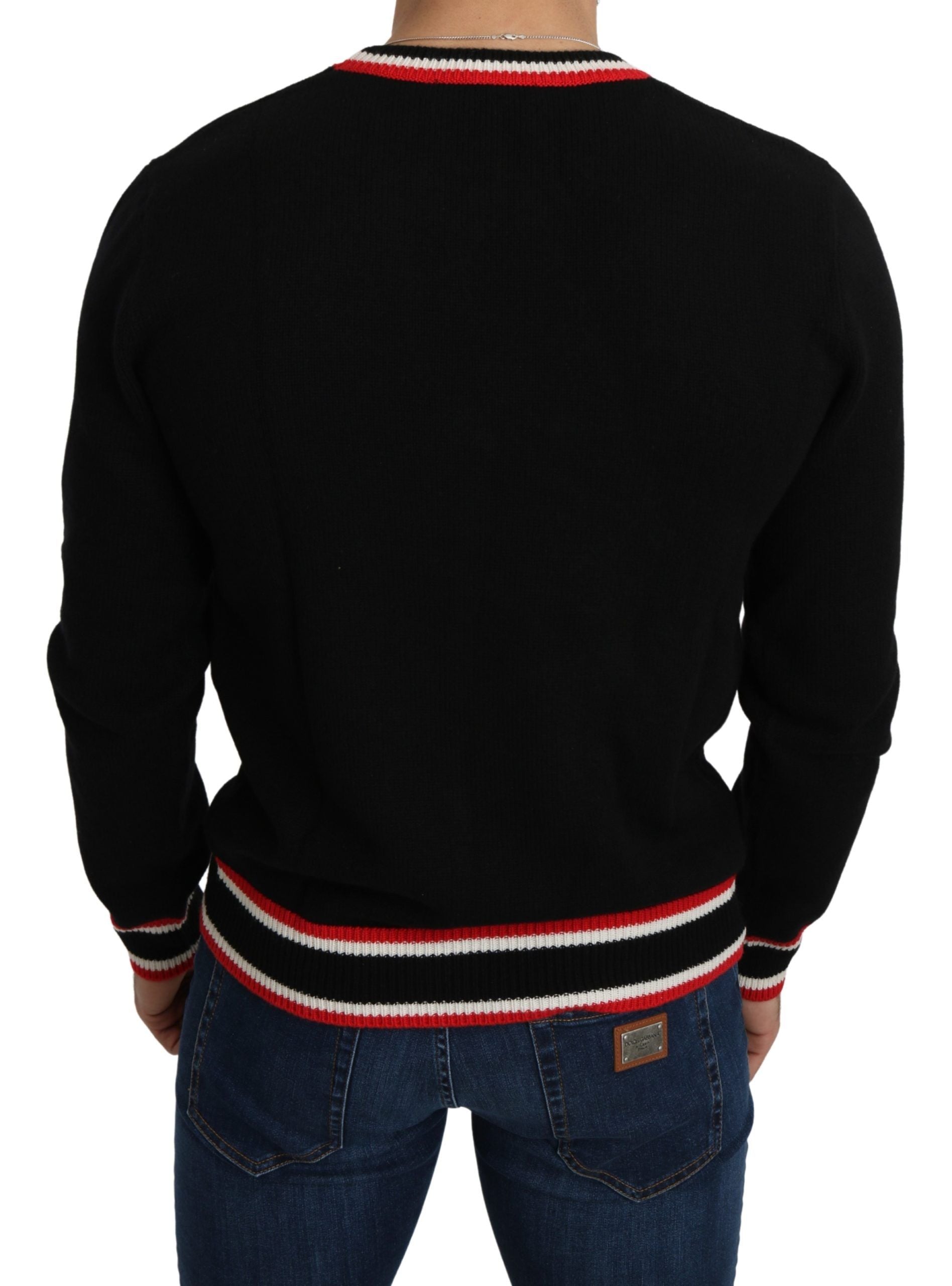 Black sweater with red stripes on sleeves