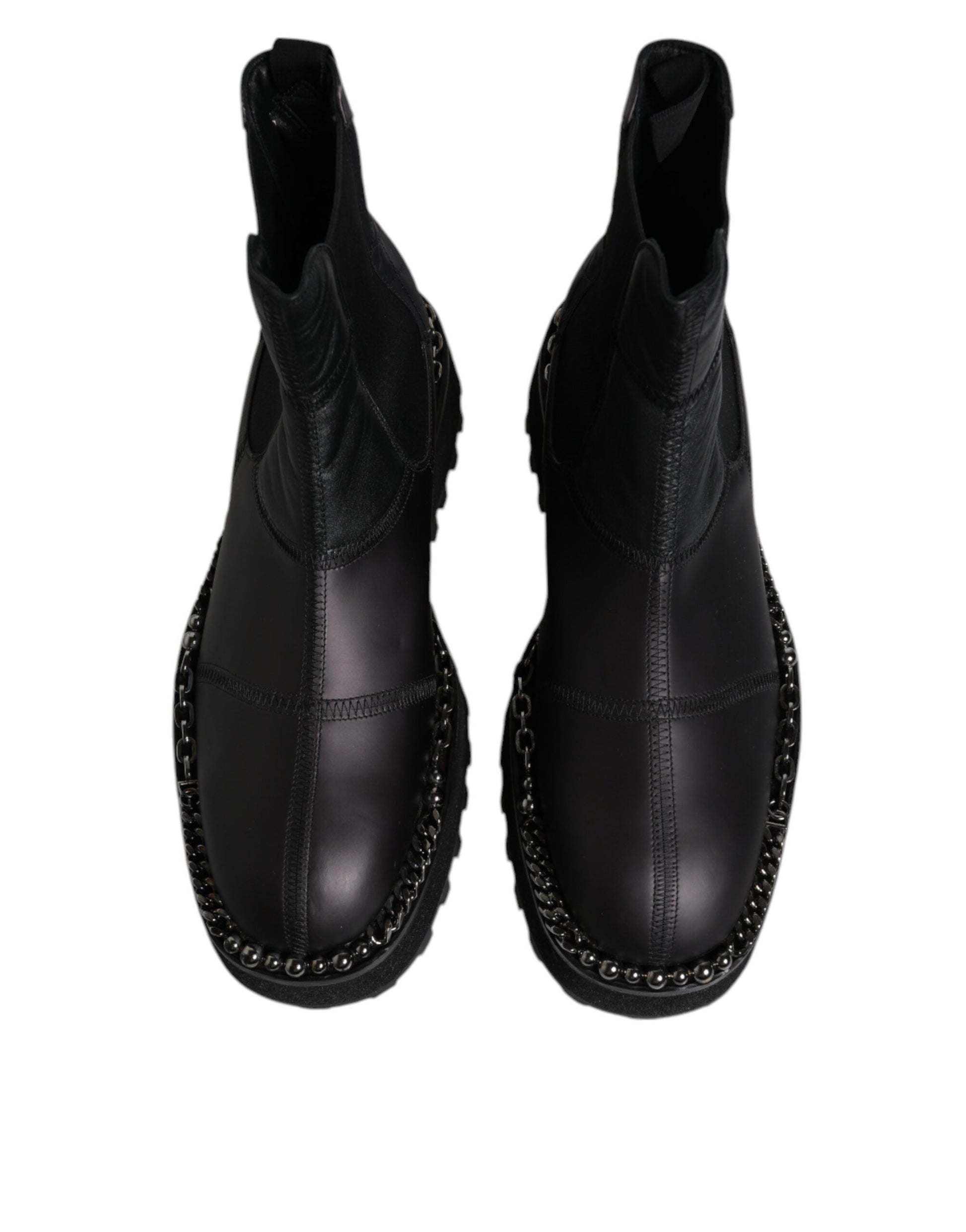 Pair of black boots with silver studs on sides