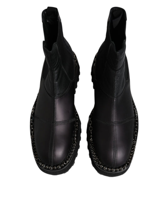 Pair of black boots with silver studs on sides