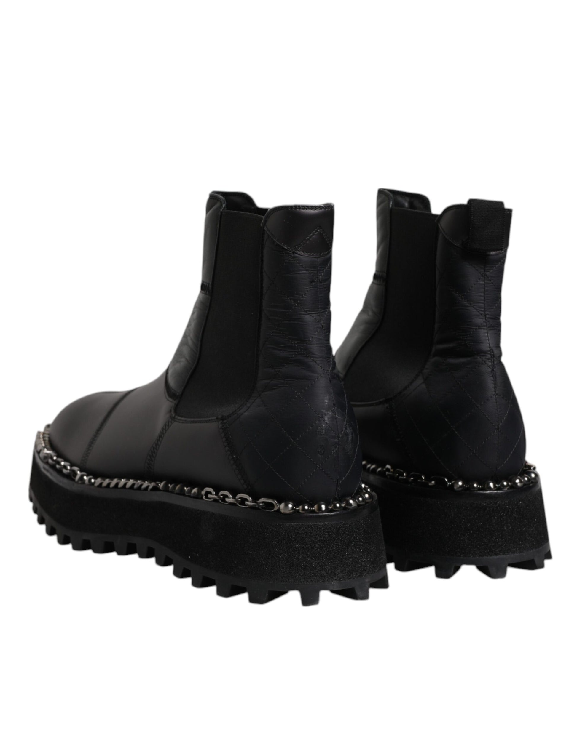 Pair of black boots with silver studs on sides