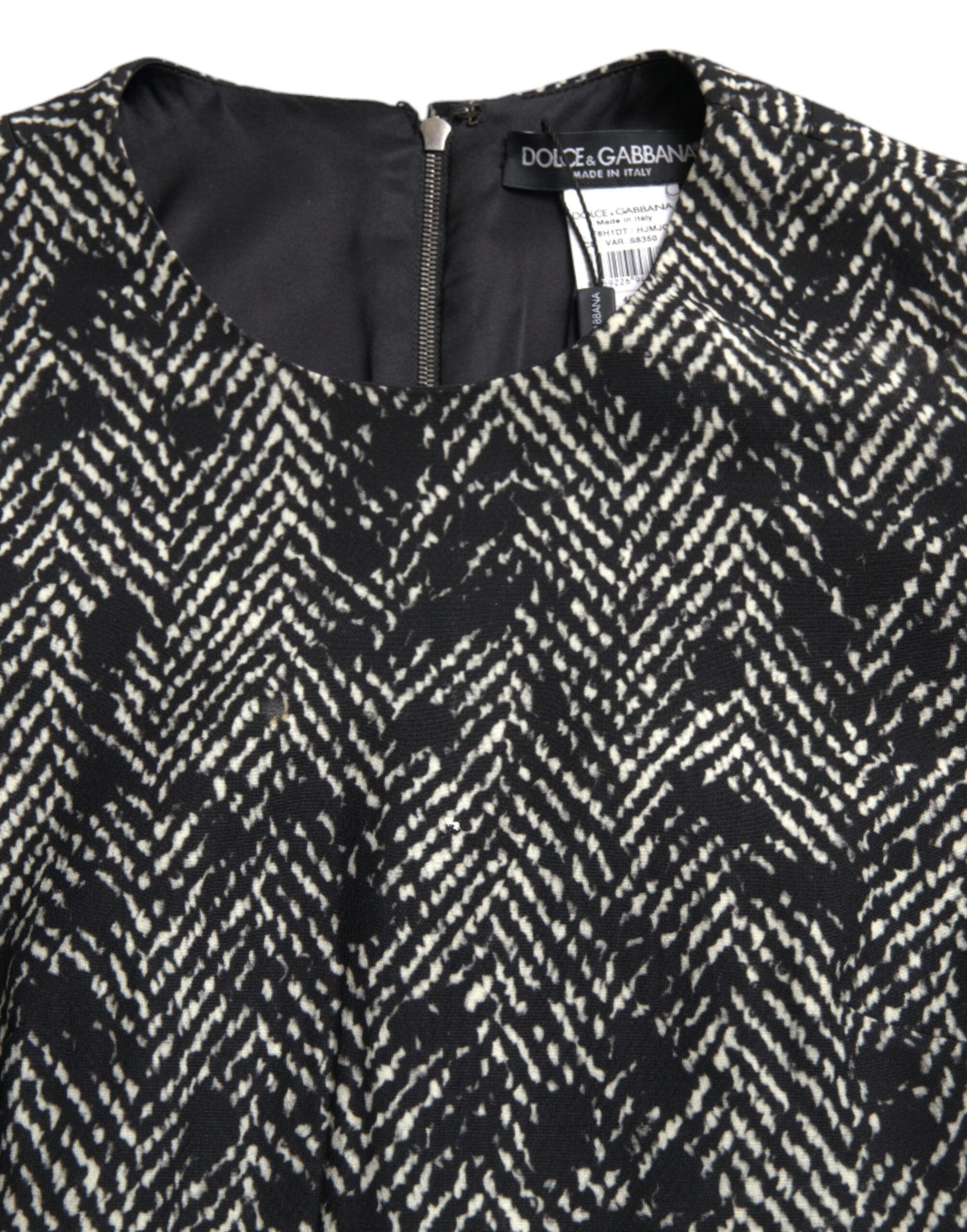A black chevron patterned mini dress by Dolce & Gabbana, made of polyester