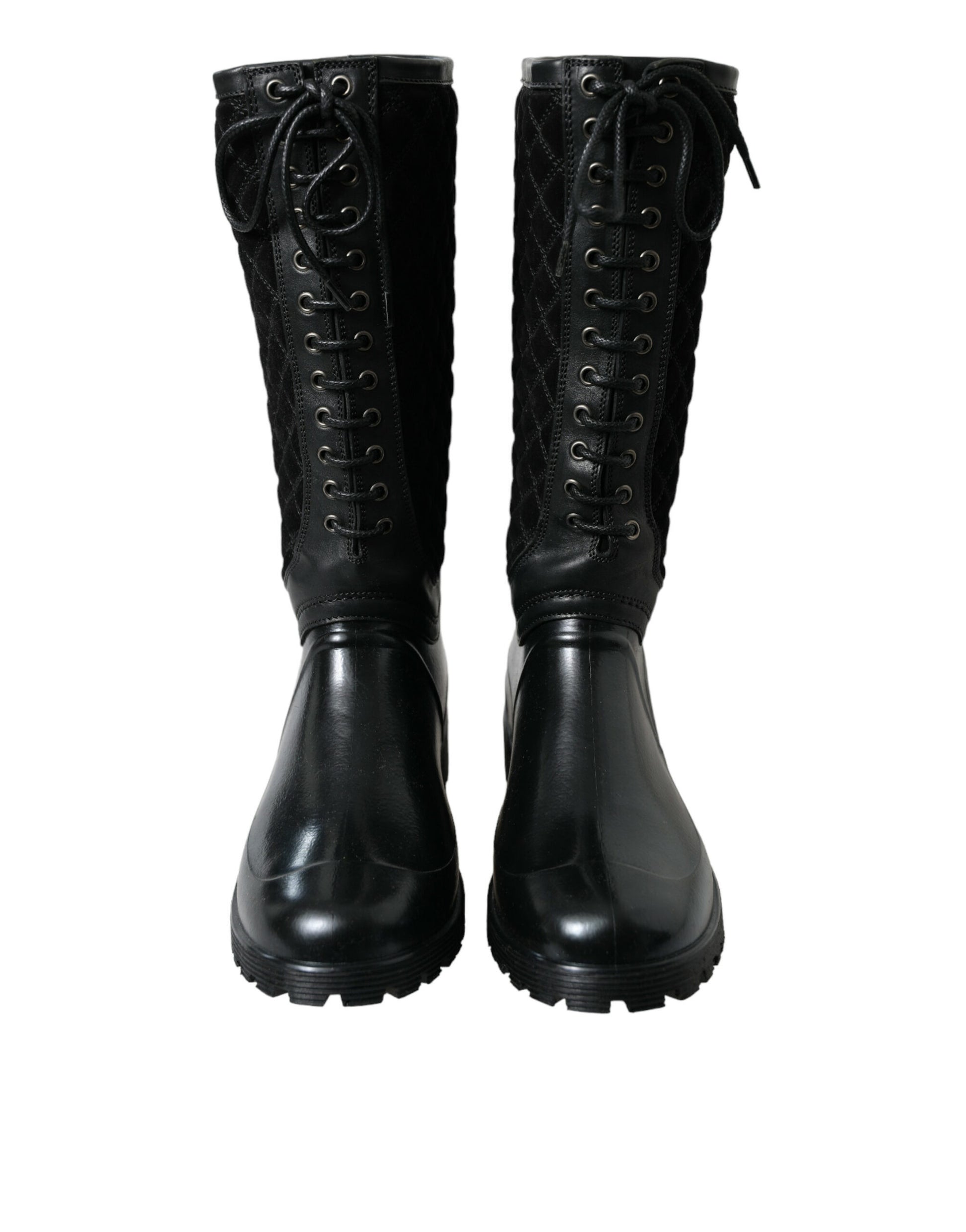 Pair of black leather boots with laces and buckles