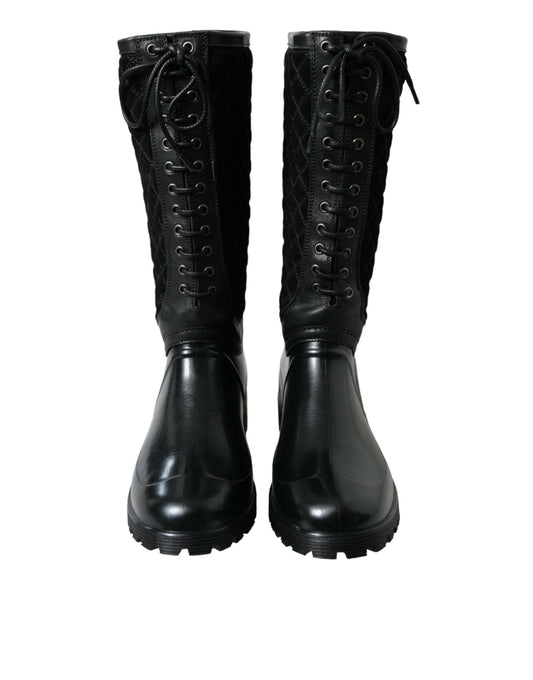 Pair of black leather boots with laces and buckles