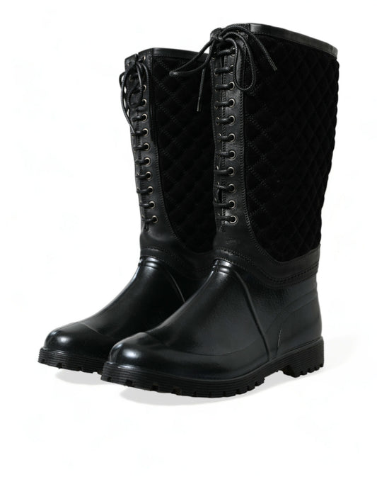 Pair of black leather boots with laces and buckles