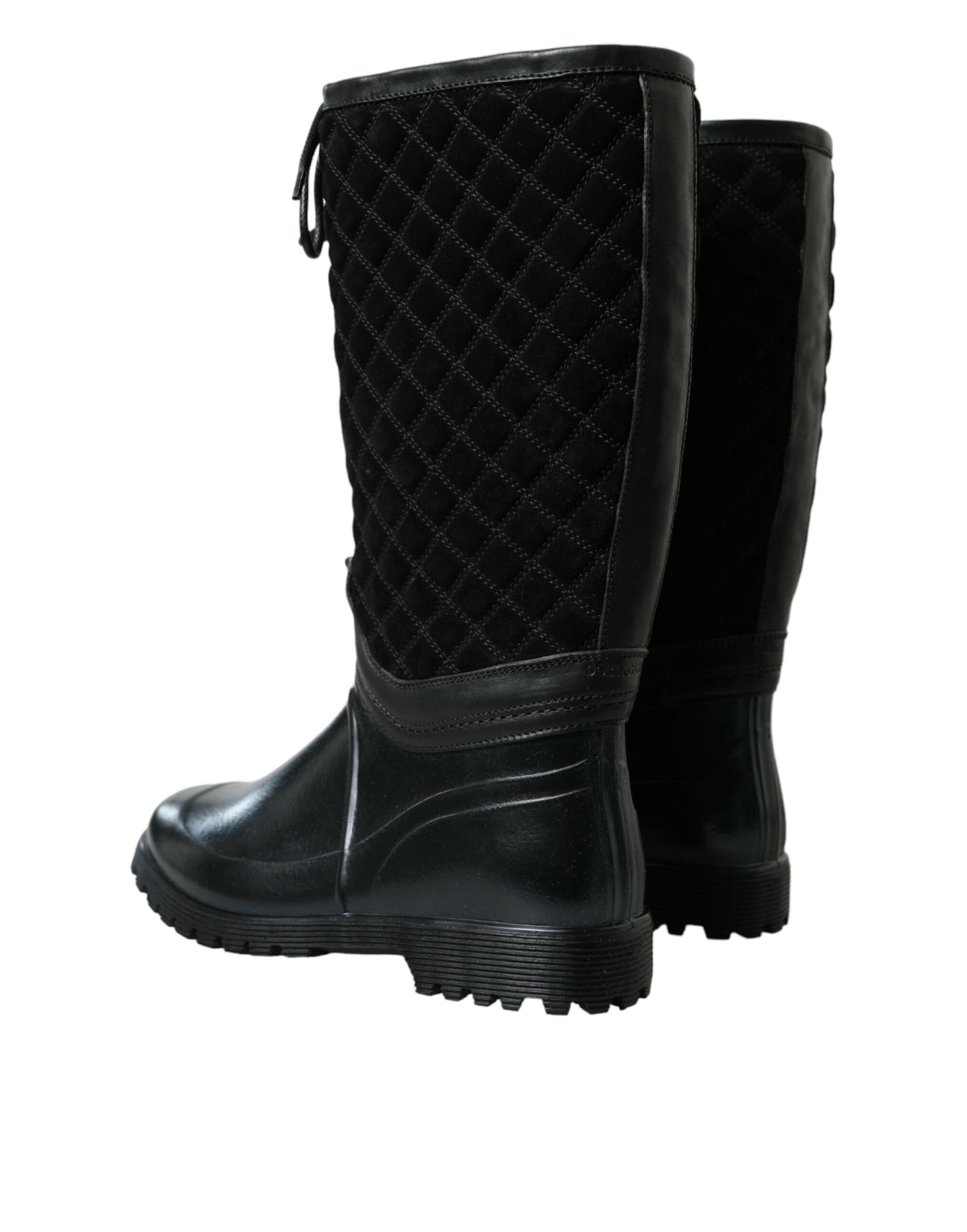 Black quilted winter boot with a thick heel and rubber sole