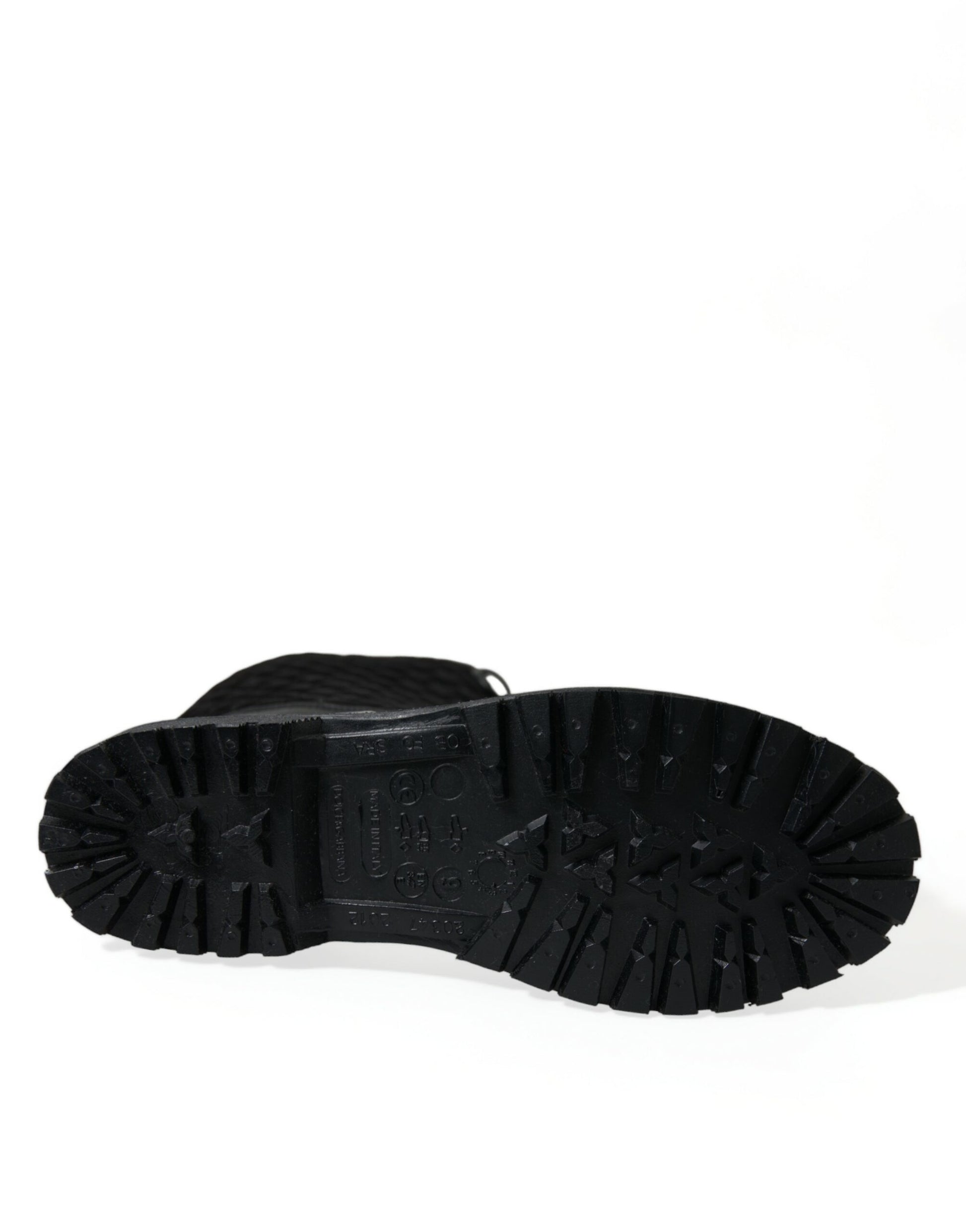 Black hiking boot with deep treads and a pull tab on top