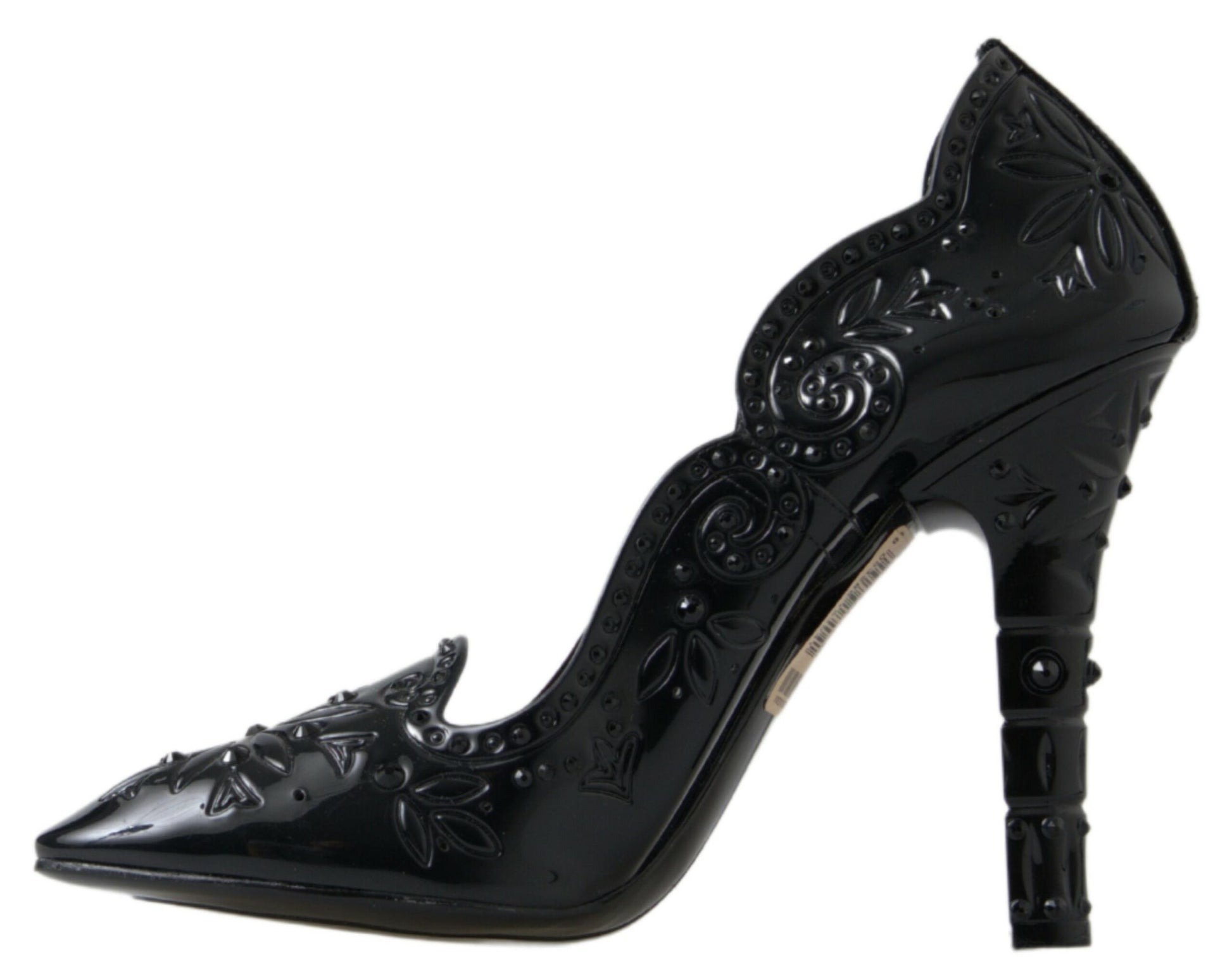 Black high heel shoe with decorative design on toe and side
