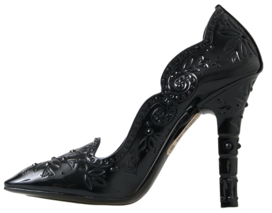 Black high heel shoe with decorative design on toe and heel