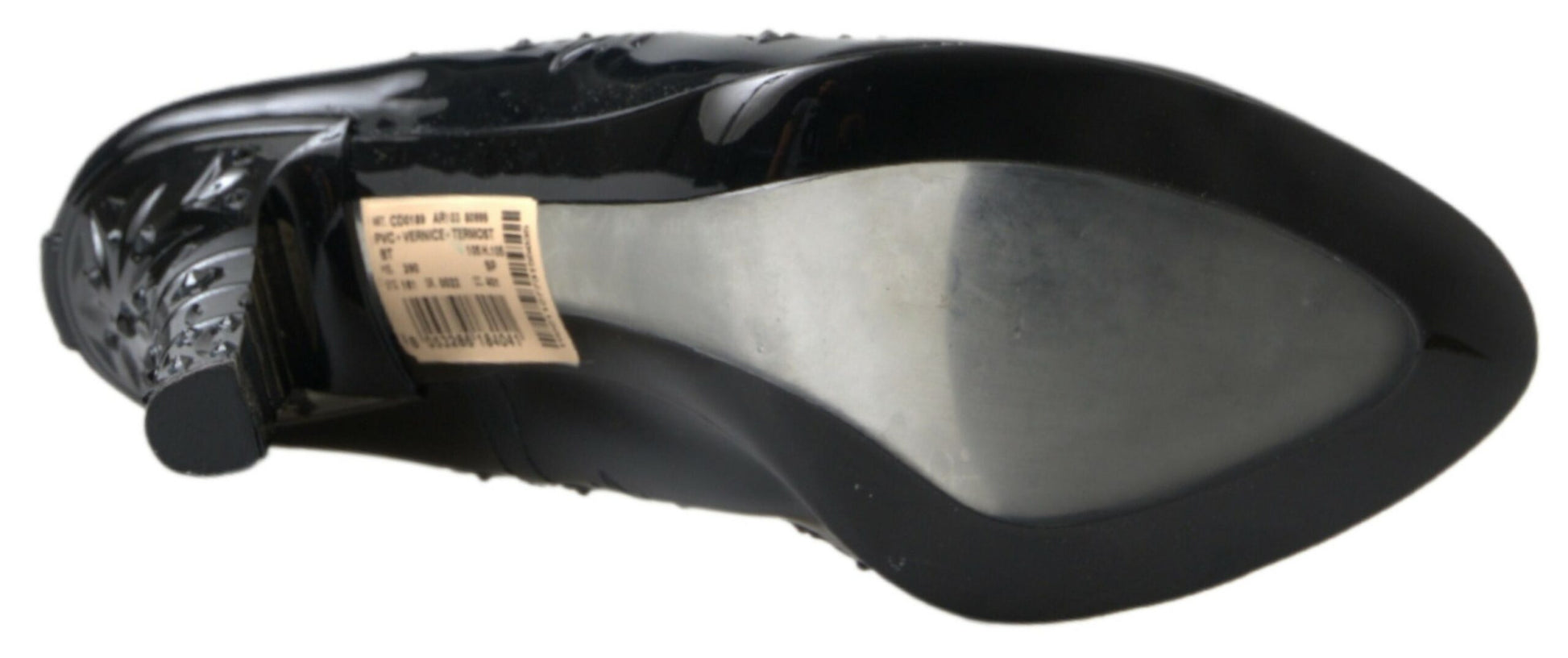 Pair of black shoes with white soles and a label on the tongue