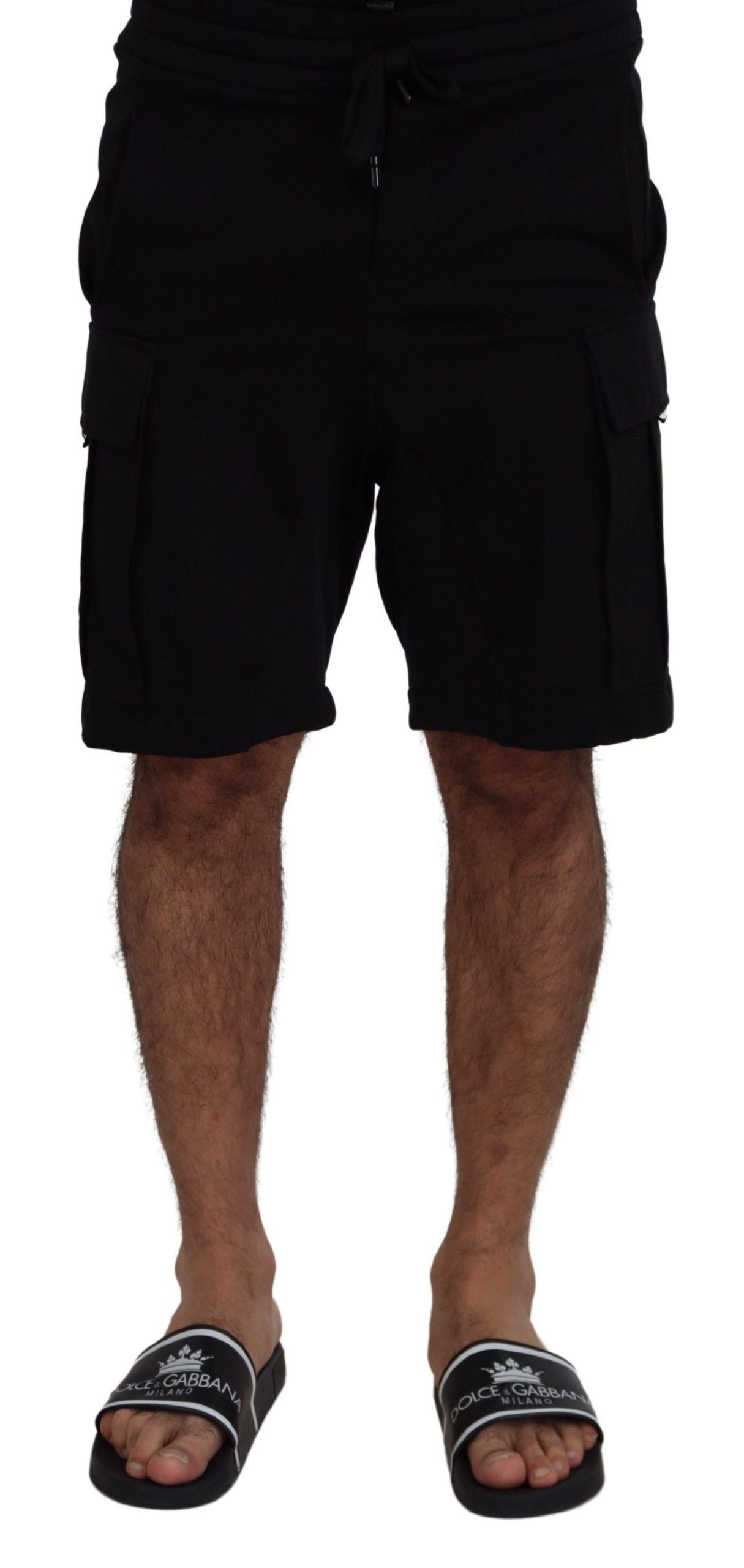 Man wearing black shorts and flip flops