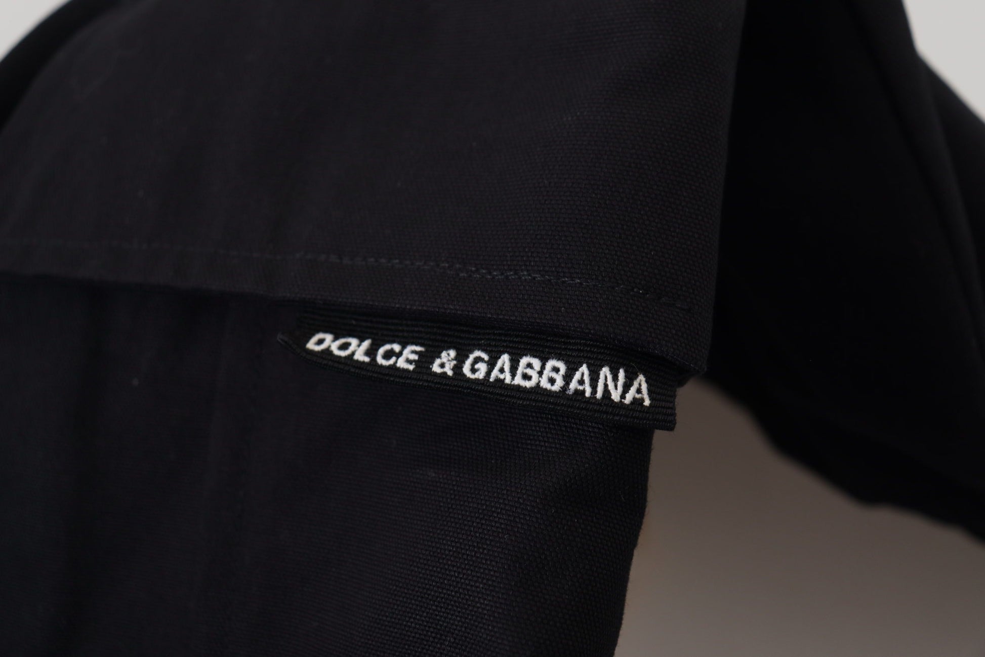 Black pants with white label on waistband