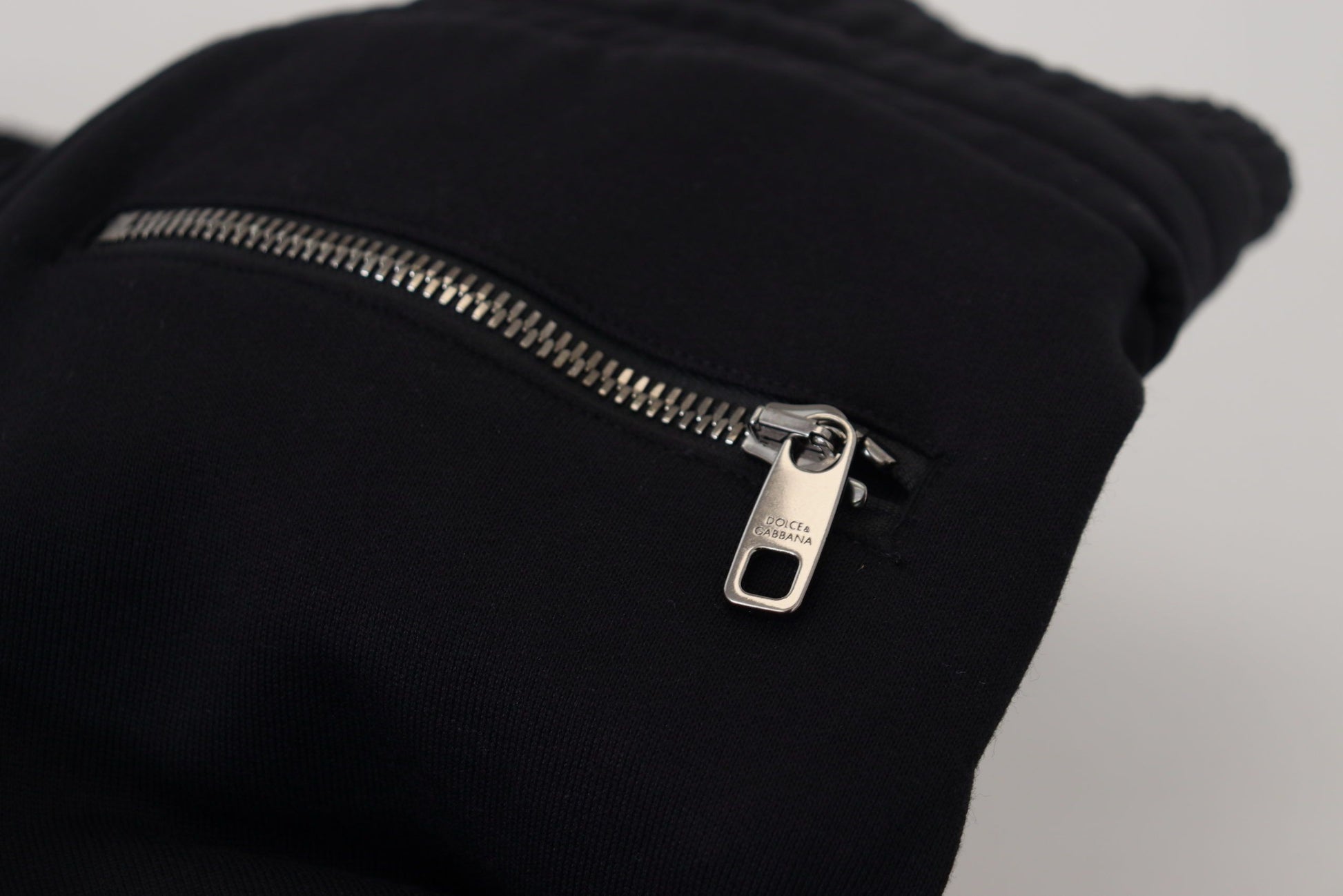 Black zippered jacket with silver zipper pull