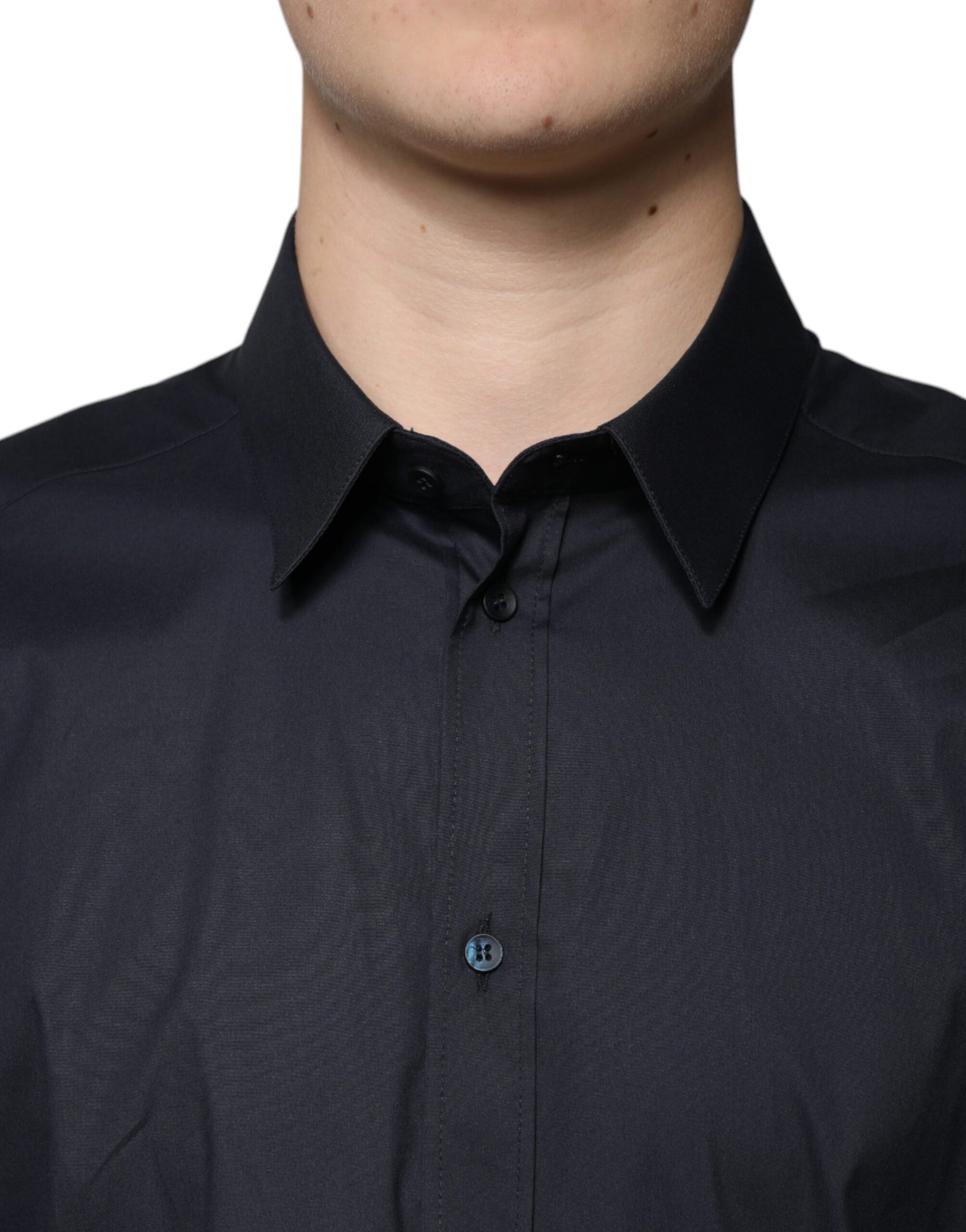 A black cotton blend dress shirt with a gold button