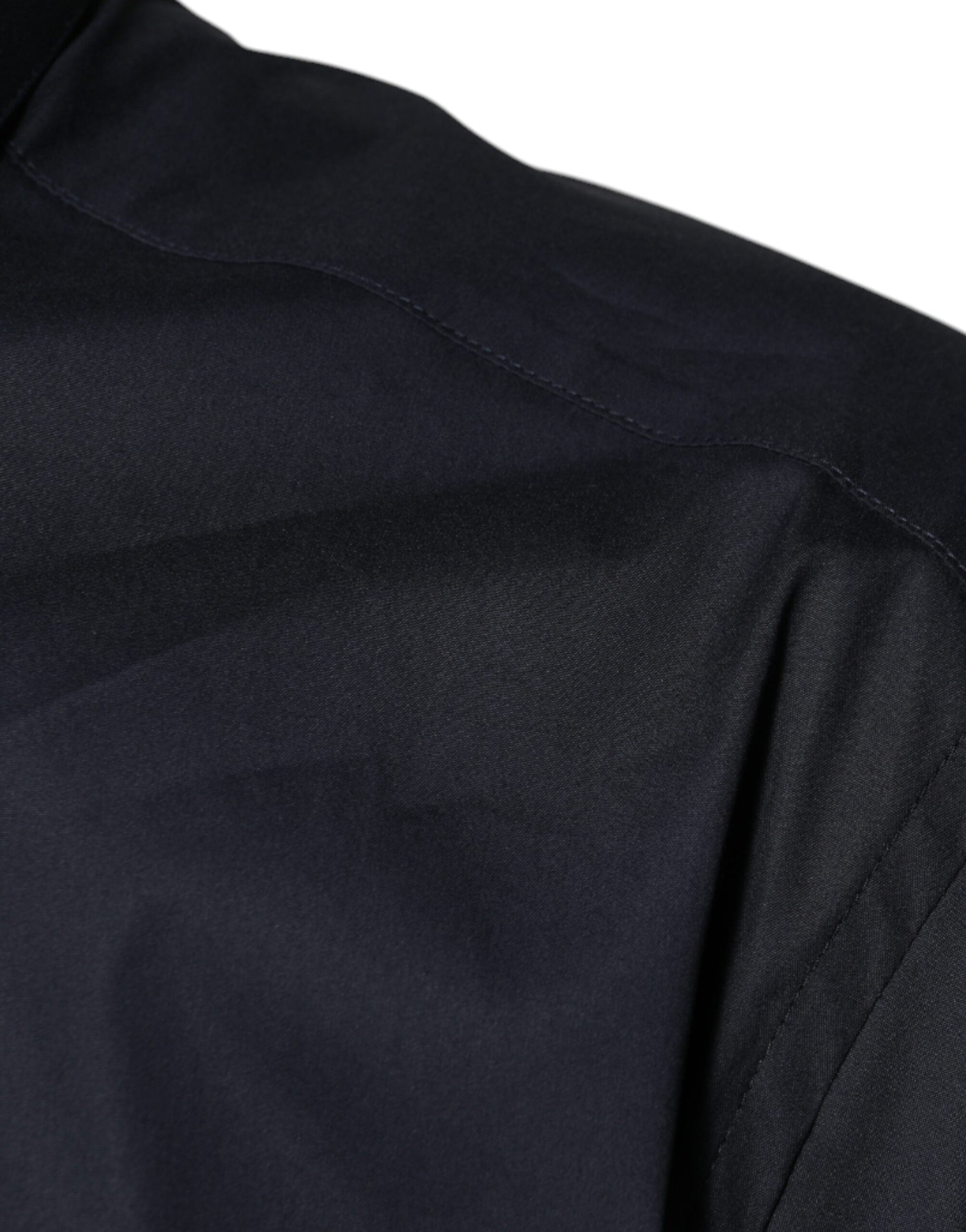 A black cotton blend formal dress shirt with a gold design on the collar