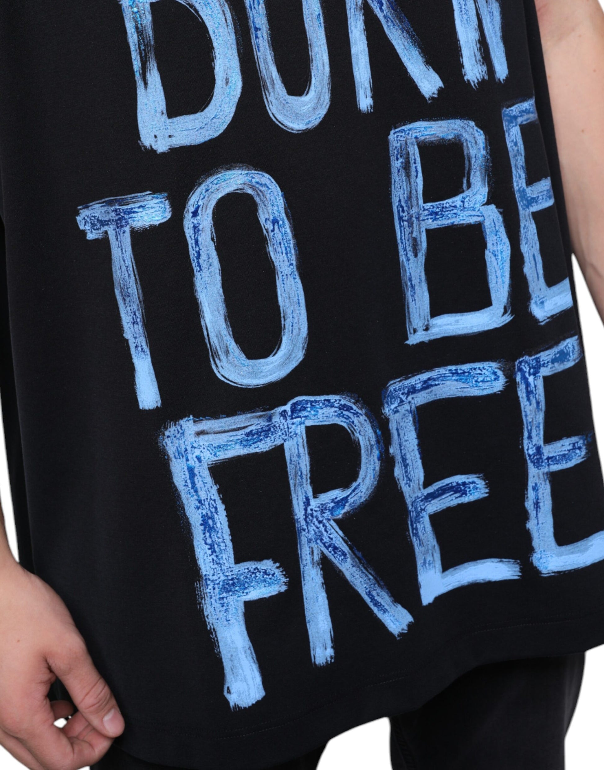 Black t-shirt with blue handwritten style text that says "born to be free"